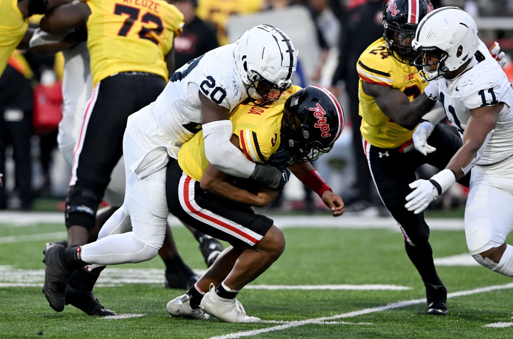 Adisa Isaac, #20 of the Penn State Nittany Lions, sacks Taulia Tagovailoa, #3 of the Maryland Terrapins, in the third quarter at SECU Stadium on Nov. 4, 2023 in College Park, Maryland.