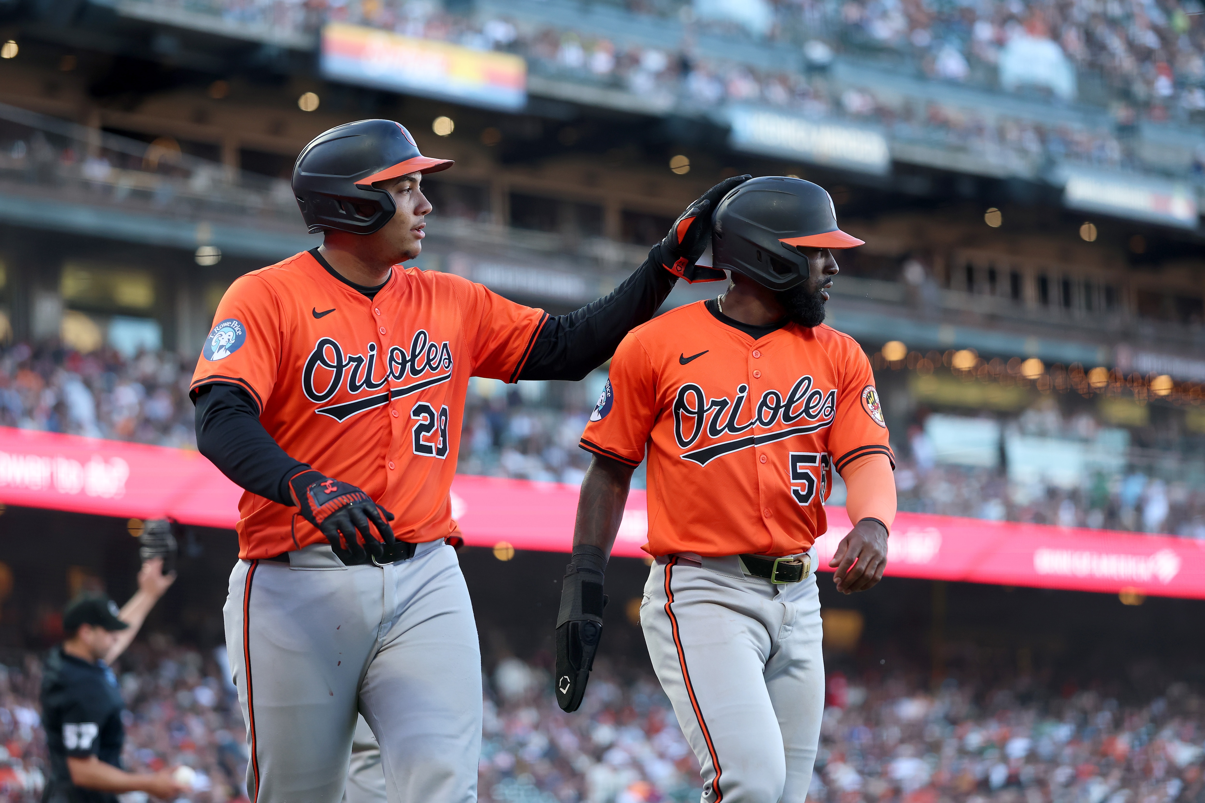 Samuel Basallo, left, pats Daniel Johnson after both scored on an eighth-inning double by Jeremiah Jackson on Saturday in San Francisco.