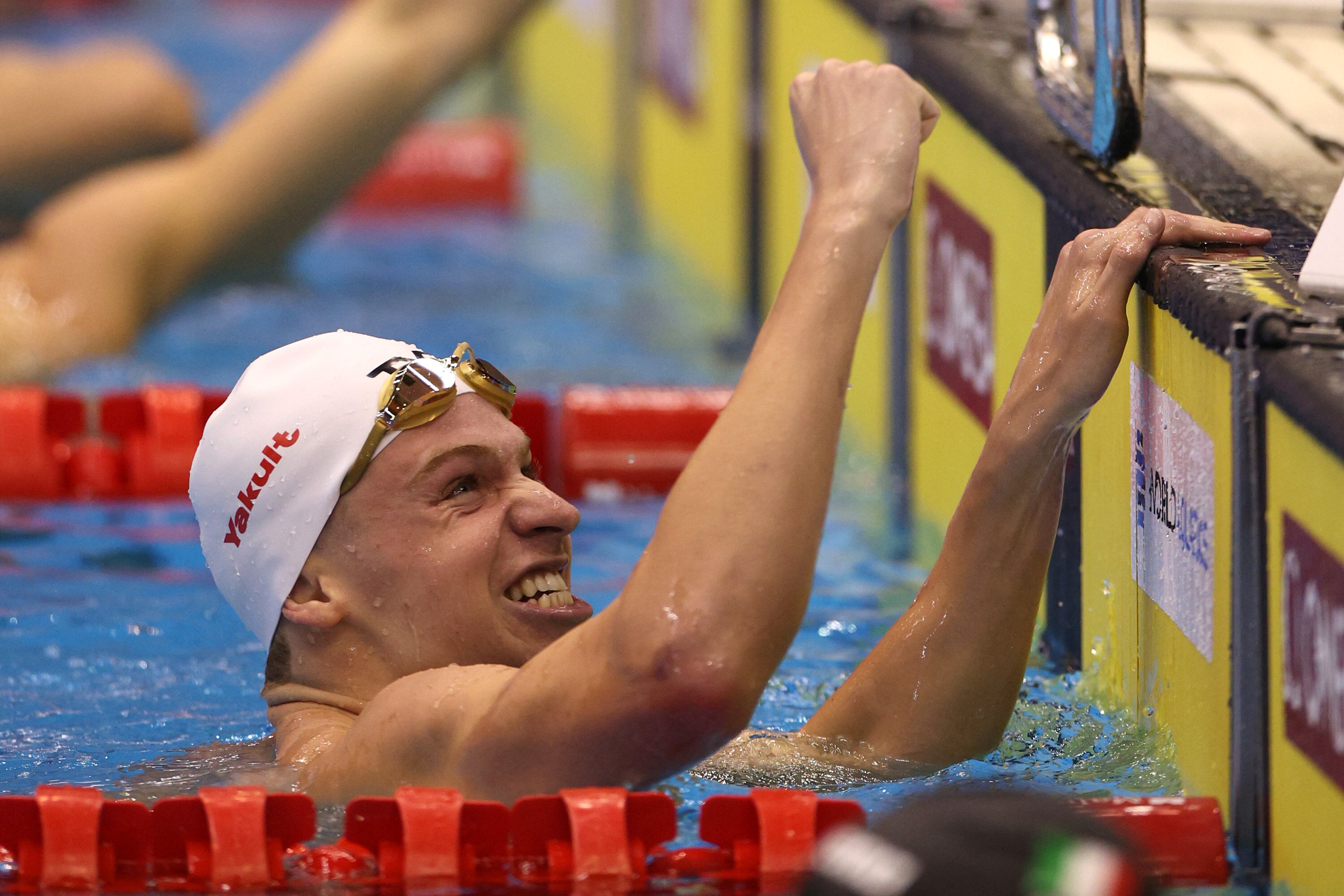 Leon Marchand of France celebrates winning gold in the men's 400-meter individual medley in a time of 4:02.50, breaking Michael Phelps' world record.