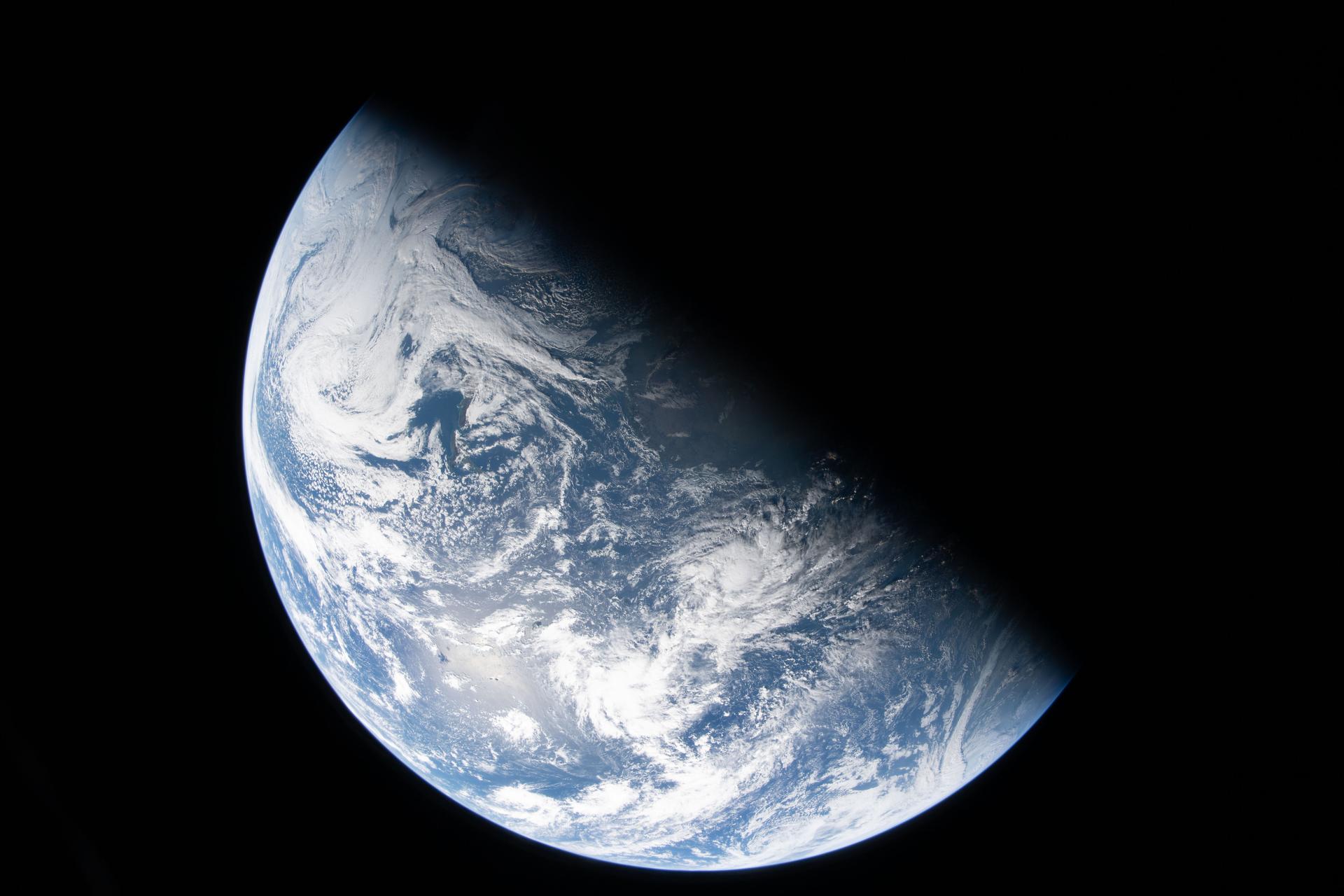 A view of Earth taken by NASA astronaut and Artemis II Commander Reid Wiseman from one of the Orion spacecraft's four windows after completing the translunar injection burn on April 2, 2026.