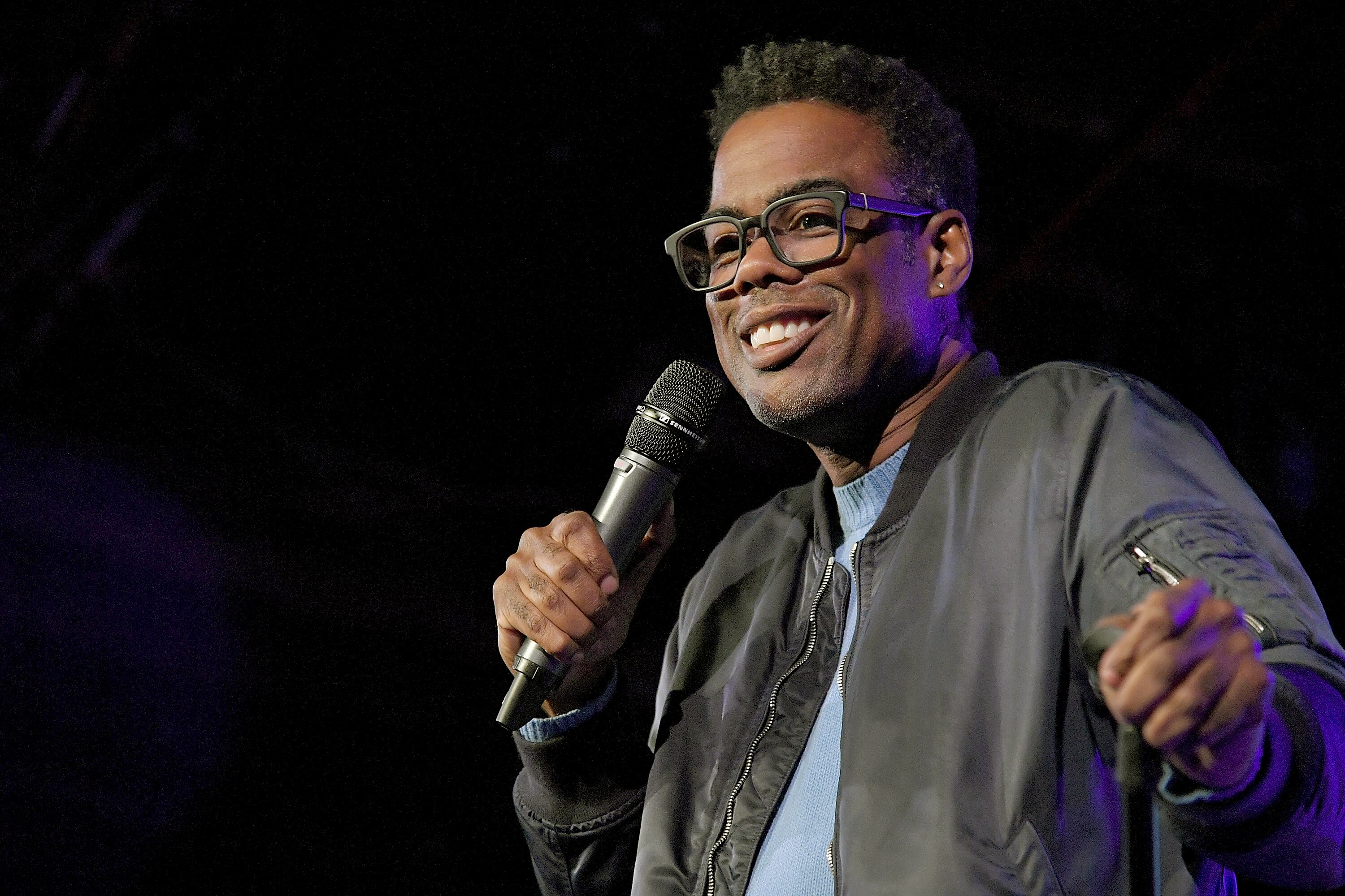 Chris Rock performs in Brooklyn at a 2018 comedy benefit.