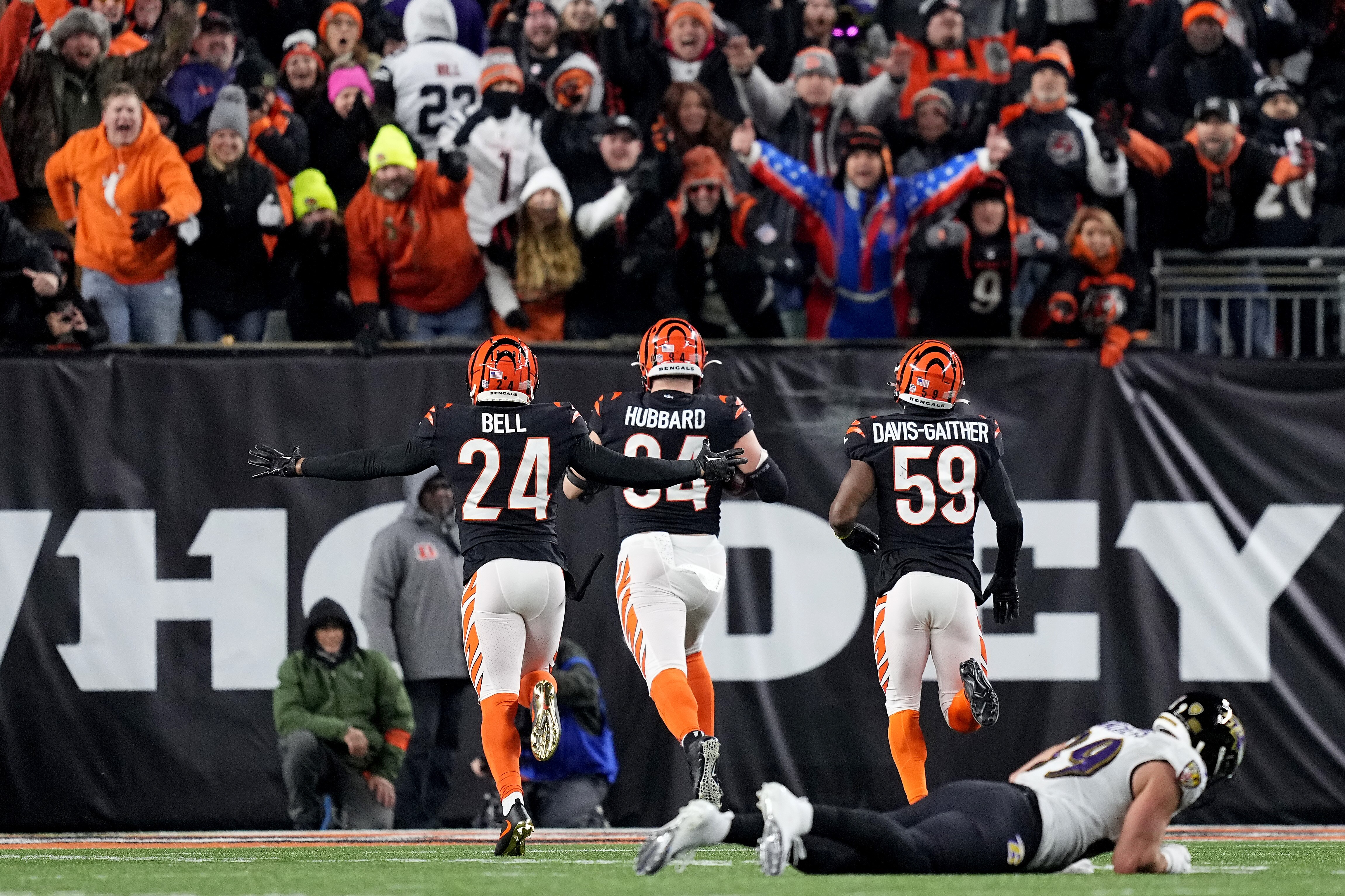 CINCINNATI, OHIO - JANUARY 15: Sam Hubbard #94 of the Cincinnati Bengals scores a 98 yard touchdown off of a recovered fumble by Tyler Huntley #2 of the Baltimore Ravens during the fourth quarter in the AFC Wild Card playoff game at Paycor Stadium on January 15, 2023 in Cincinnati, Ohio. (Photo by Dylan Buell/Getty Images)