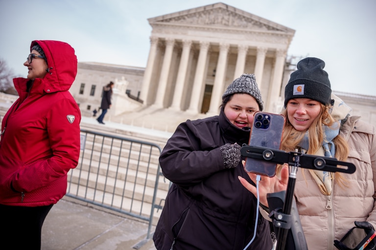 WASHINGTON, DC - JANUARY 10: Content creators Callie Goodwin of Columbia, S.C., (L) and Sarah Baus of Charleston, S.C., (R) speak to a live stream audience outside the U.S. Supreme Court Building after the court heard oral arguments on whether to overturn or delay a law that could lead to a ban of TikTok in the U.S., on January 10, 2025 in Washington, DC. The future of TikTok, the wildly popular social media platform, is at stake as the Supreme Court hears arguments on a law set to take effect the day before Inauguration Day that would force their China-based parent company to cut ties with TikTok due to national security concerns.