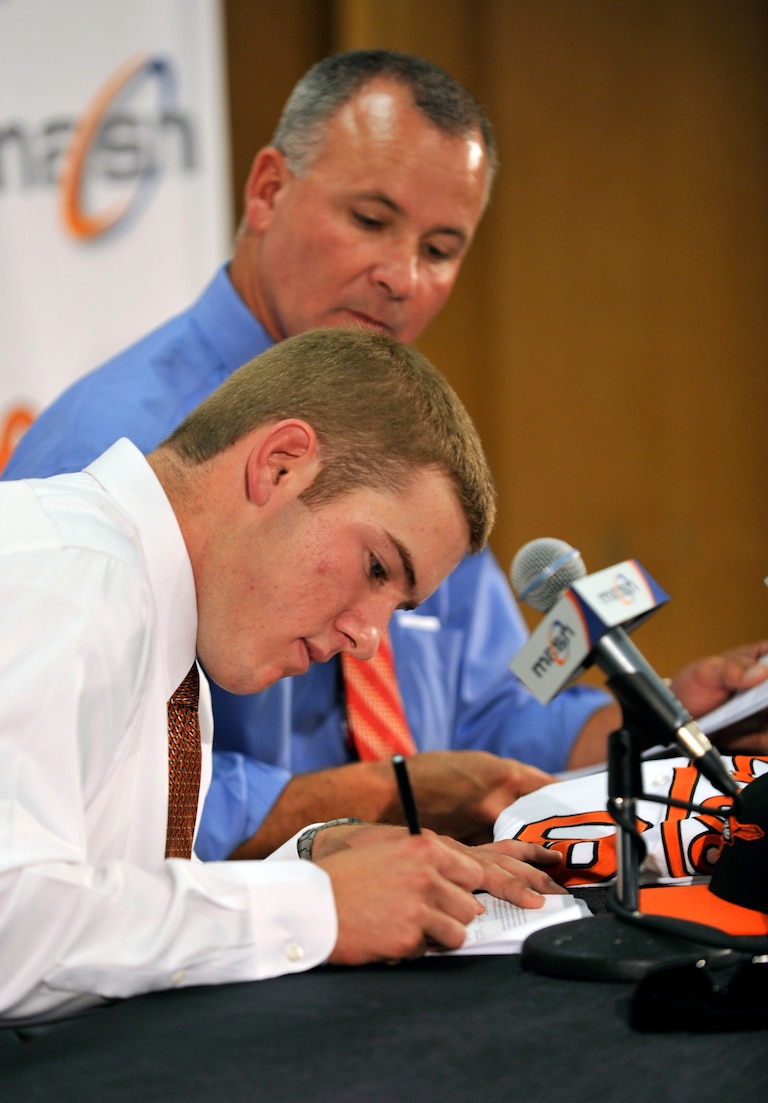 Baltimore Orioles first round draft pick Matt Hobgood signs with the team as Director of Scouting Joe Jordan looks on Saturday, June 27, 2009.