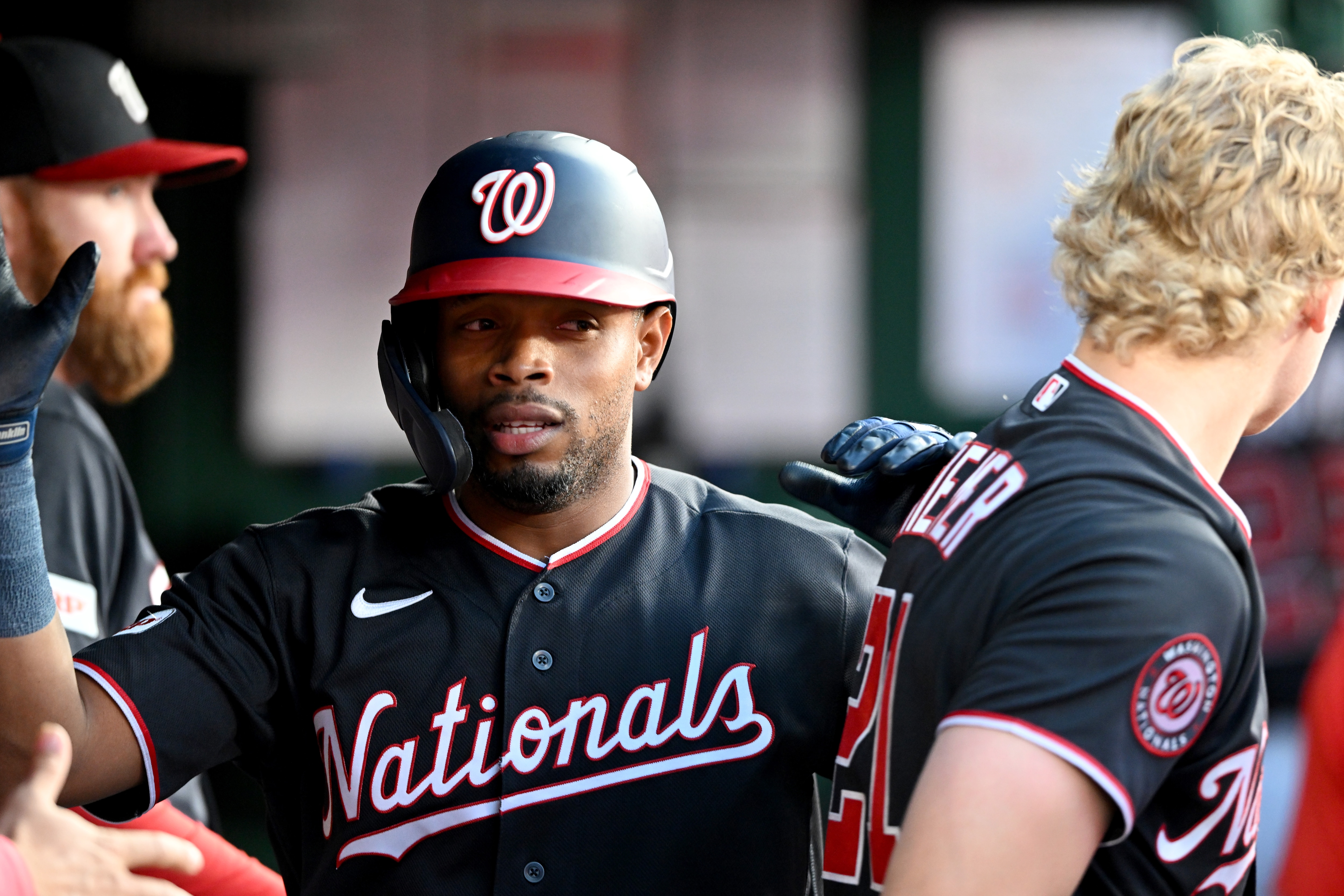 José Tena of the Nationals celebrates with teammates after scoring in the third inning Friday night against the Giants.