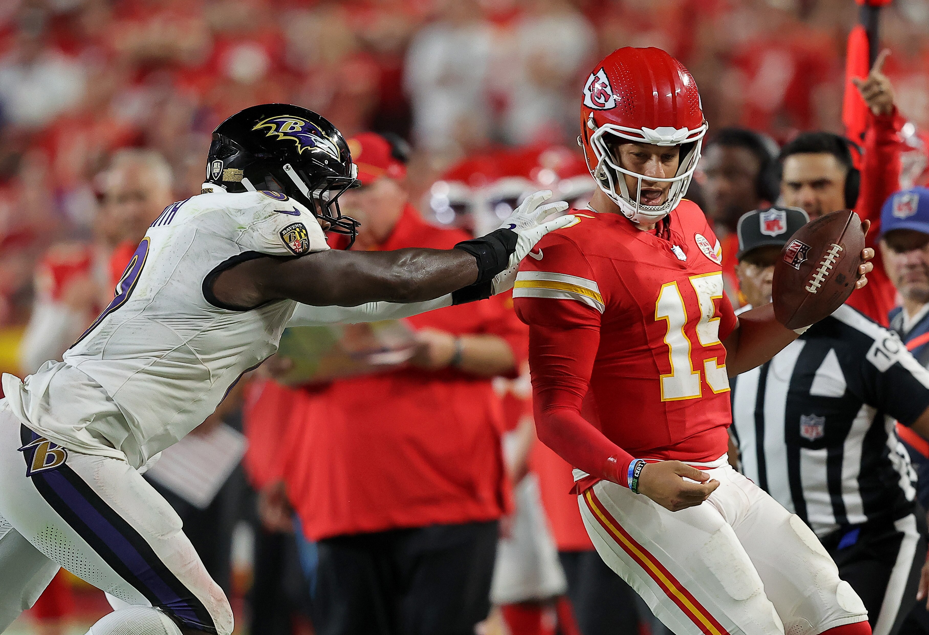 KANSAS CITY, MISSOURI - SEPTEMBER 05: Roquan Smith #0 of the Baltimore Ravens has a late hit on quarterback Patrick Mahomes #15 of the Kansas City Chiefs during the fourth quarter at GEHA Field at Arrowhead Stadium on September 05, 2024 in Kansas City, Missouri. (Photo by David Eulitt/Getty Images)