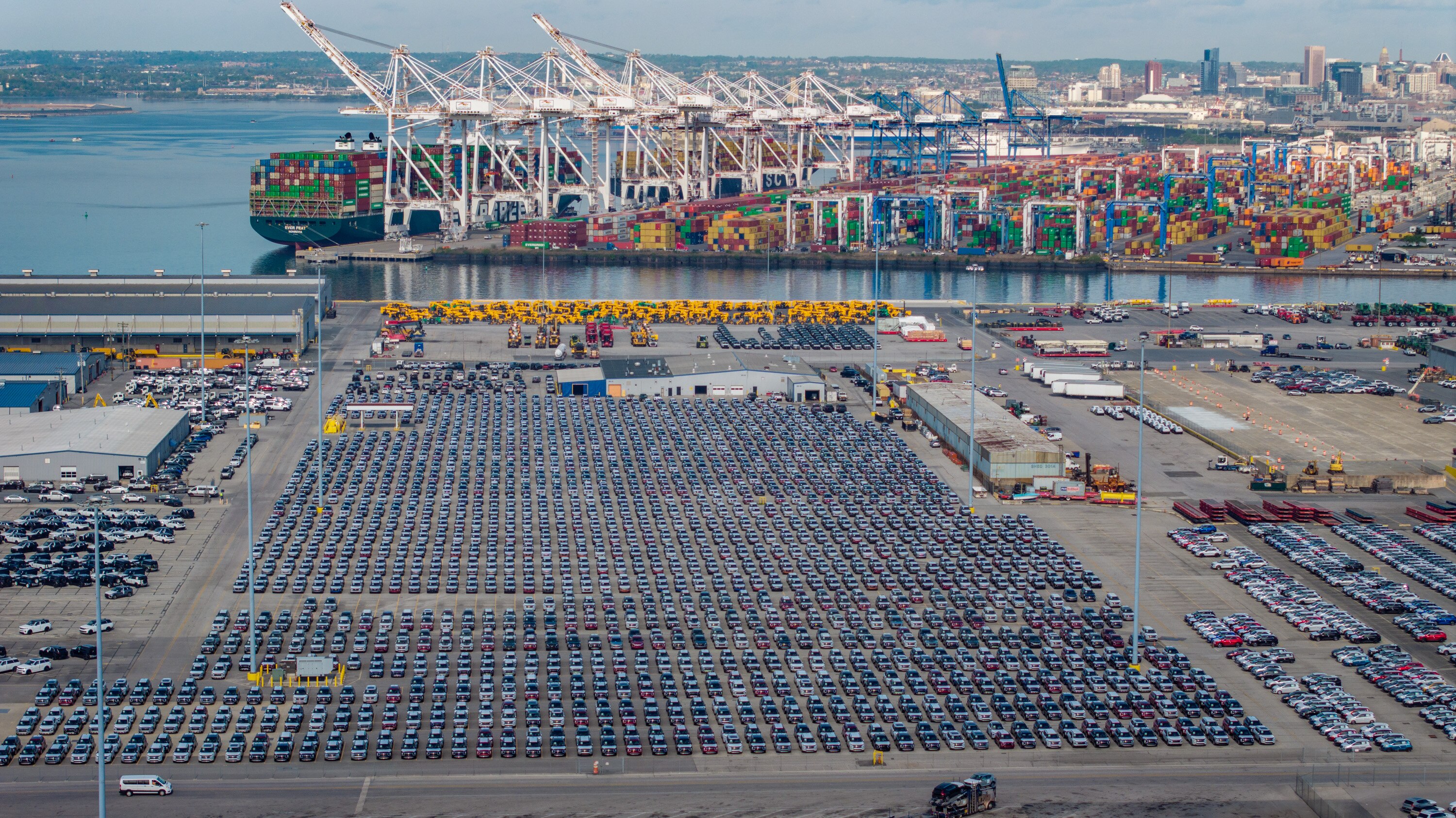 New Mitsubishis are parked at the Port of Baltimore’s Dundalk Marine Terminal on Tuesday.