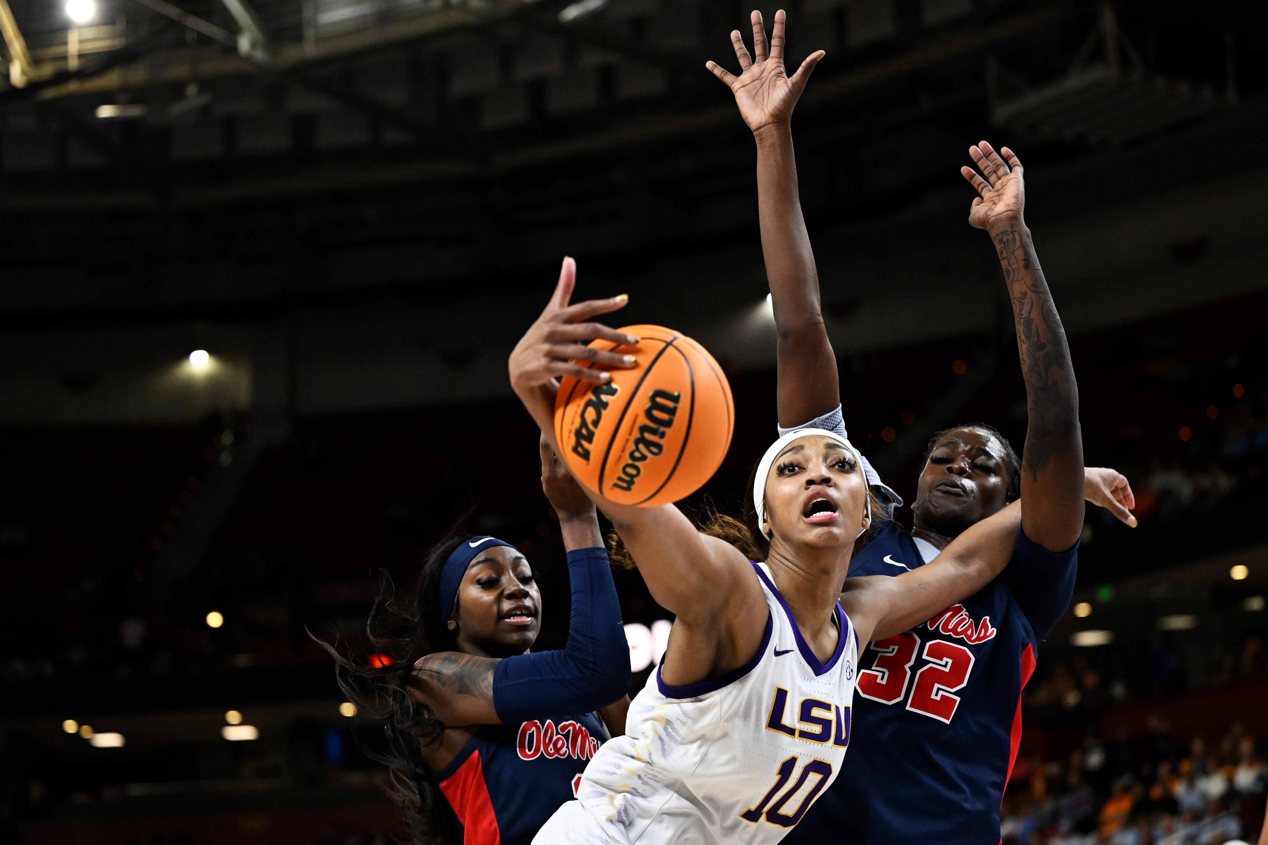 Angel Reese of LSU gets fouled as she grabs a rebound during the third quarter of the SEC semifinal Saturday against Mississippi.