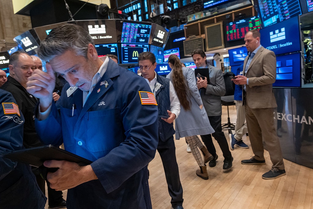 Traders work on the floor of the New York Stock Exchange (NYSE) on April 04, 2025 in New York City.