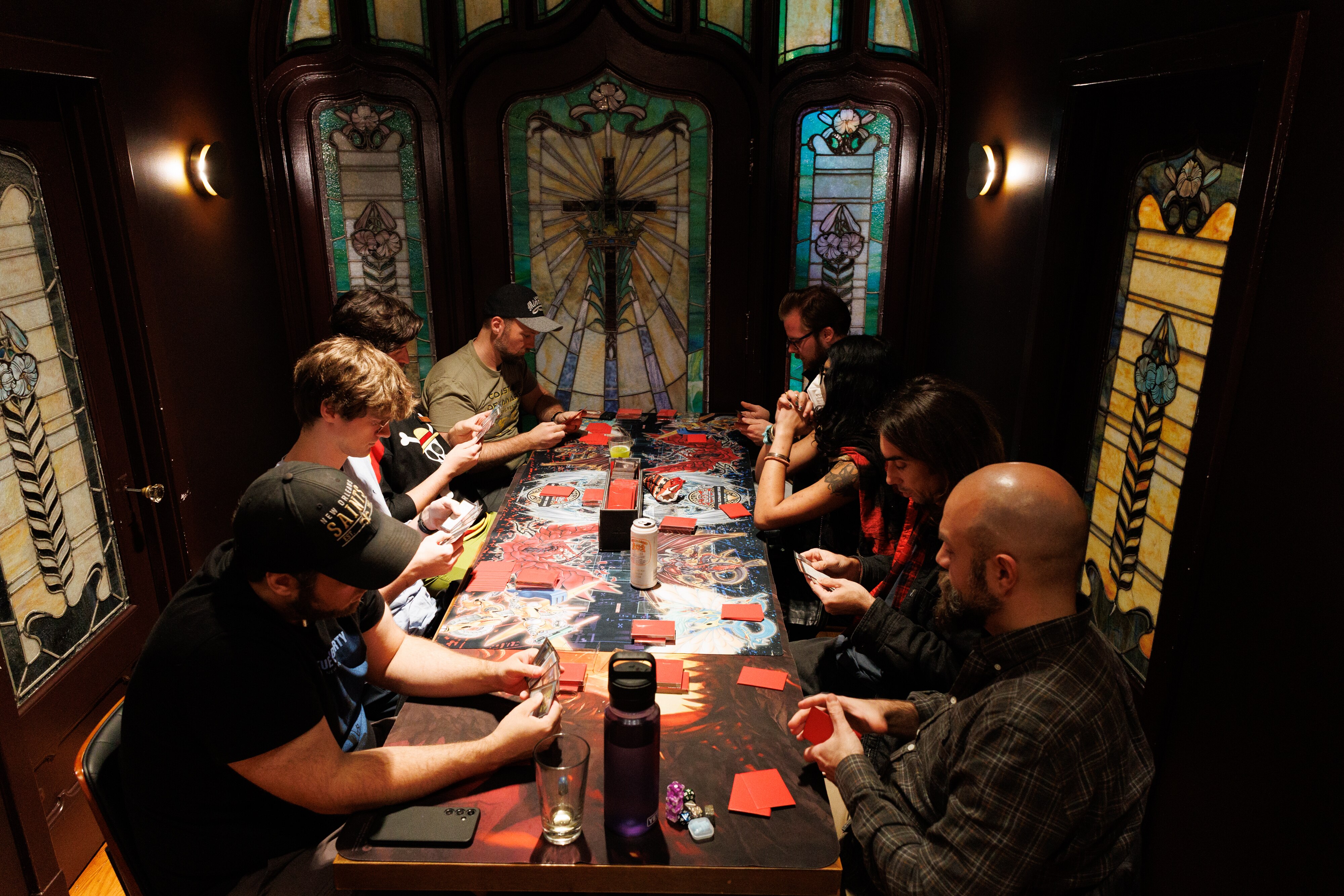 Patrons play Magic: The Gathering at the new North Avenue location of No Land Beyond.