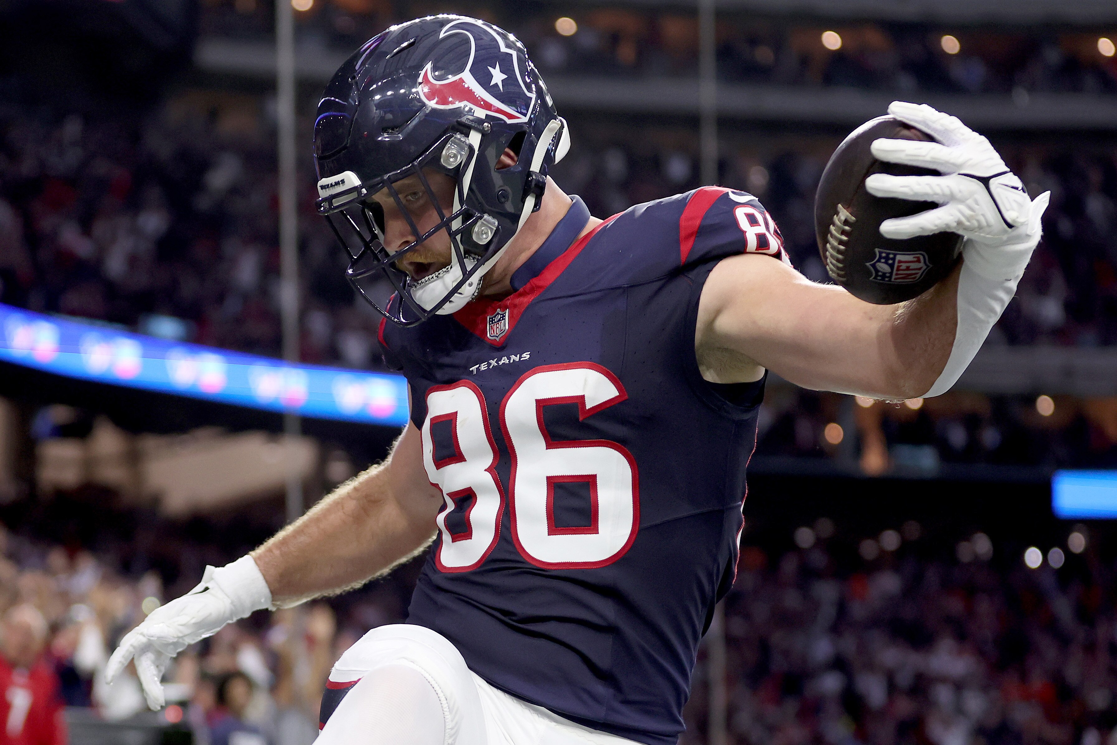 Dalton Schultz #86 of the Houston Texans celebrates after scoring a 37-yard touchdown against the Cleveland Browns during the second quarter in the AFC Wild Card Playoffs at NRG Stadium on January 13, 2024, in Houston, Texas.