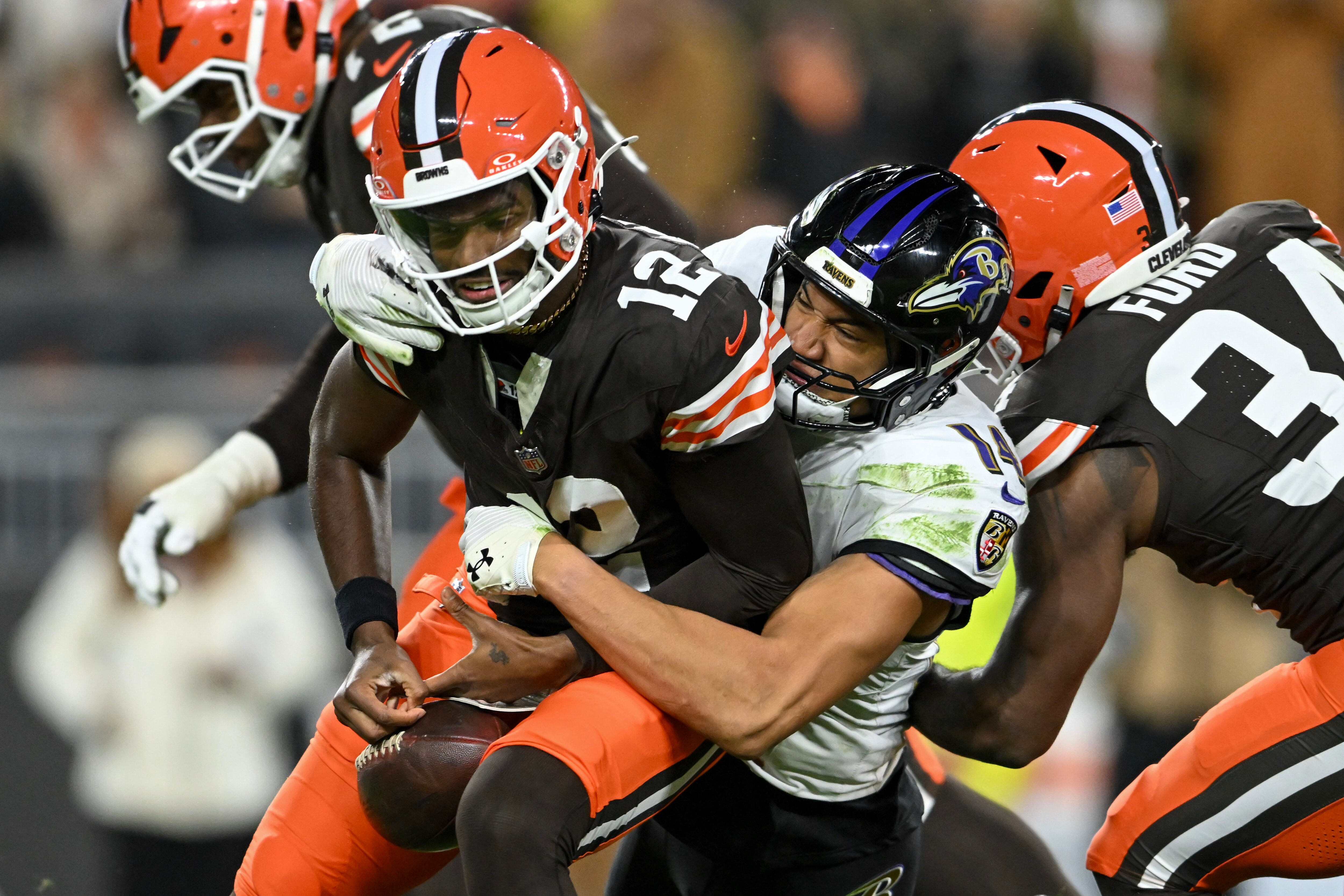 Ravens safety Kyle Hamilton sacks Browns quarterback Shedeur Sanders in the third quarter after the rookie made his NFL debut in relief of the inured Dillion Gabriel. 