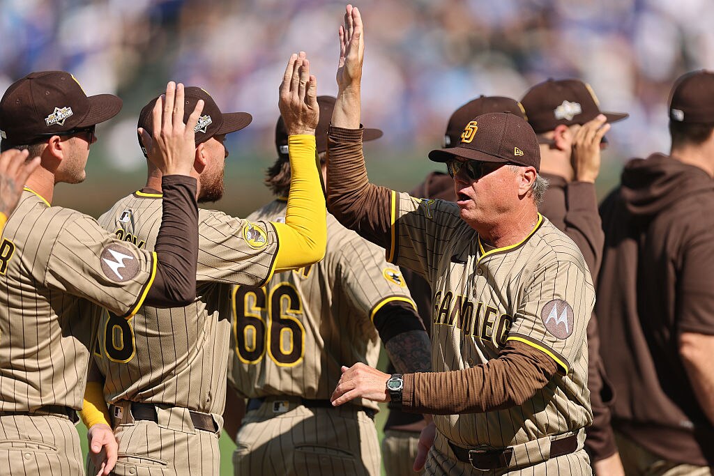 San Diego Padres manager Mike Shildt high fives players during pregame introductions prior to Game 1 of the National League Wild Card Series.