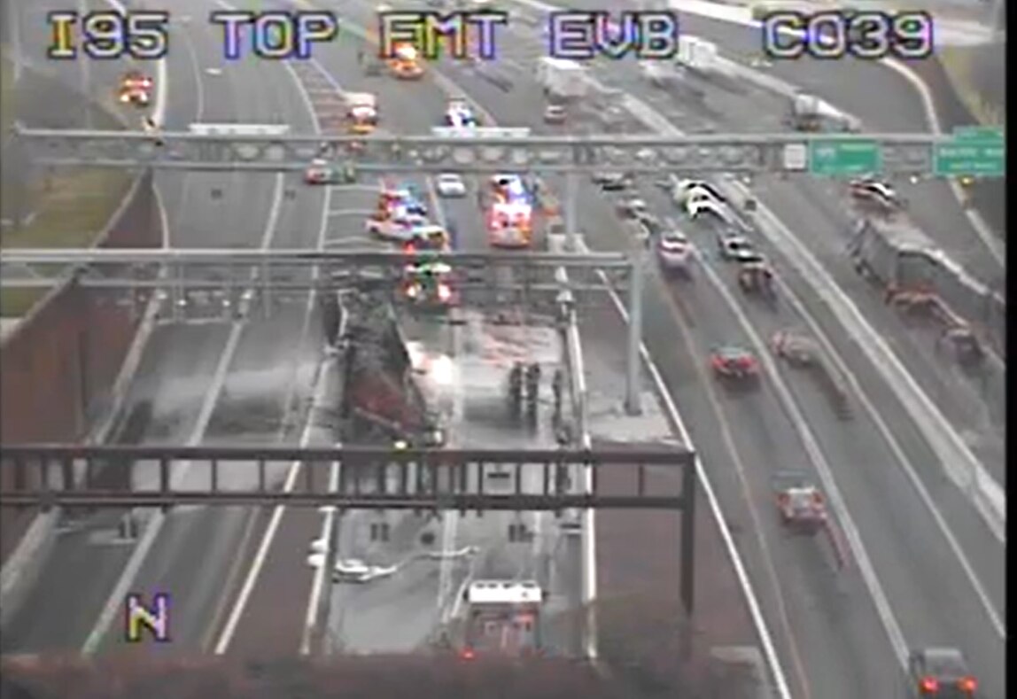 Oil spread across the lanes of I-95 after a tractor trailer crash.