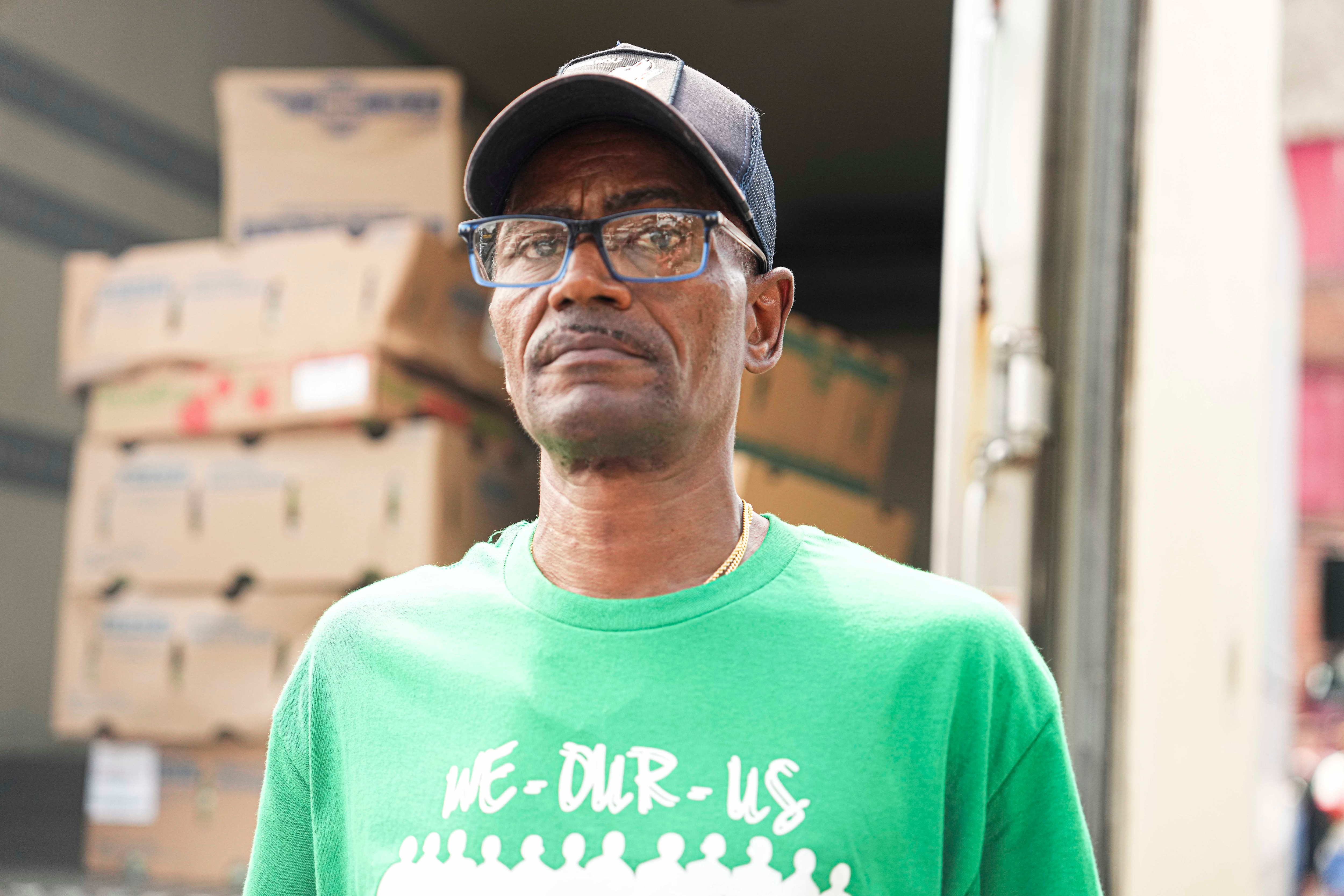 Carlos Battle, 59, of West Baltimore, helps organize and deliver food and school supplies with We Our Us, a nonprofit organization that guides boys and men to resources and encourages them to take on prominent roles in the community, in Baltimore on Aug. 26, 2023.