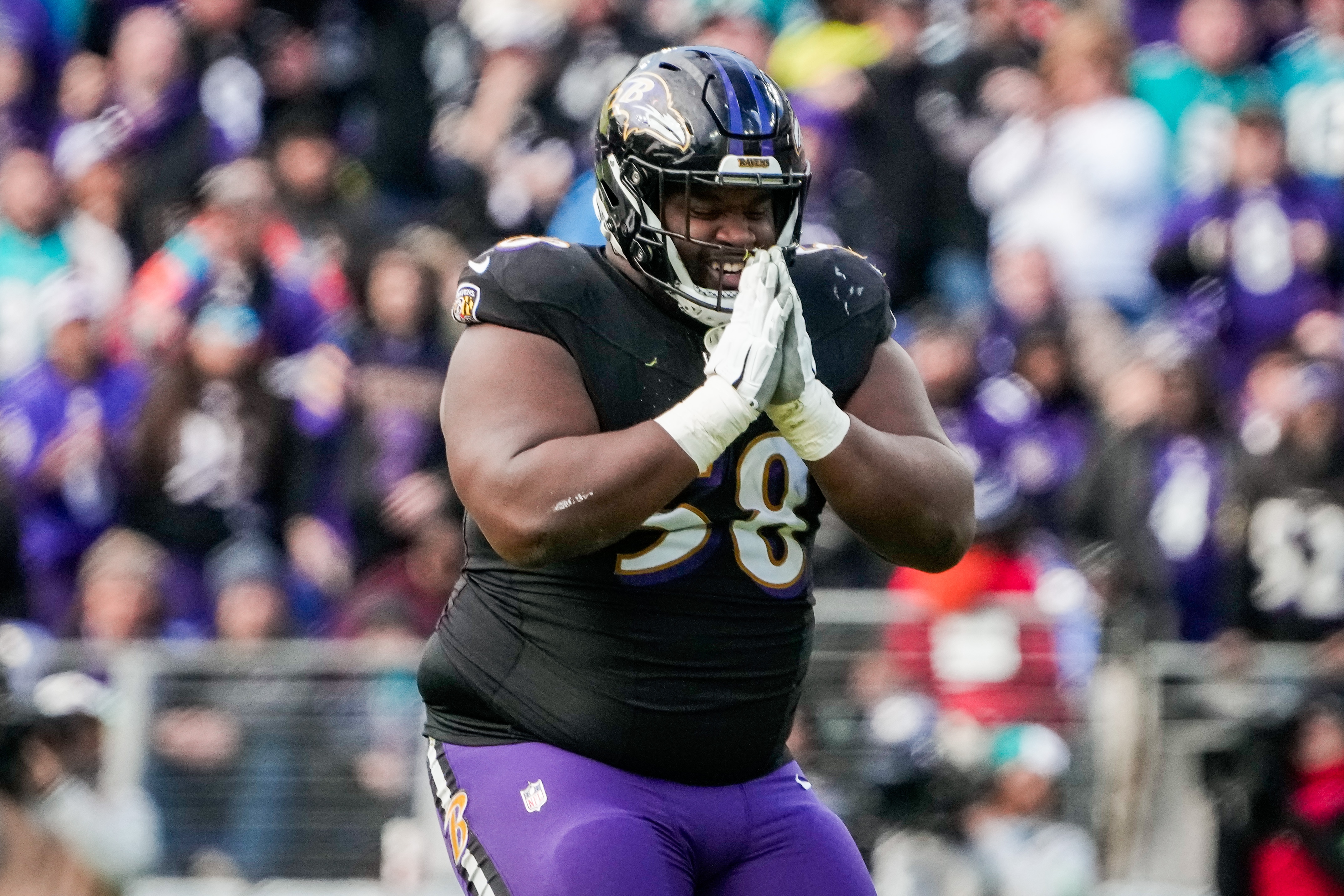 Ravens defensive tackle Michael Pierce celebrates after sacking the Miami Dolphins' Tua Tagovailoa last week.