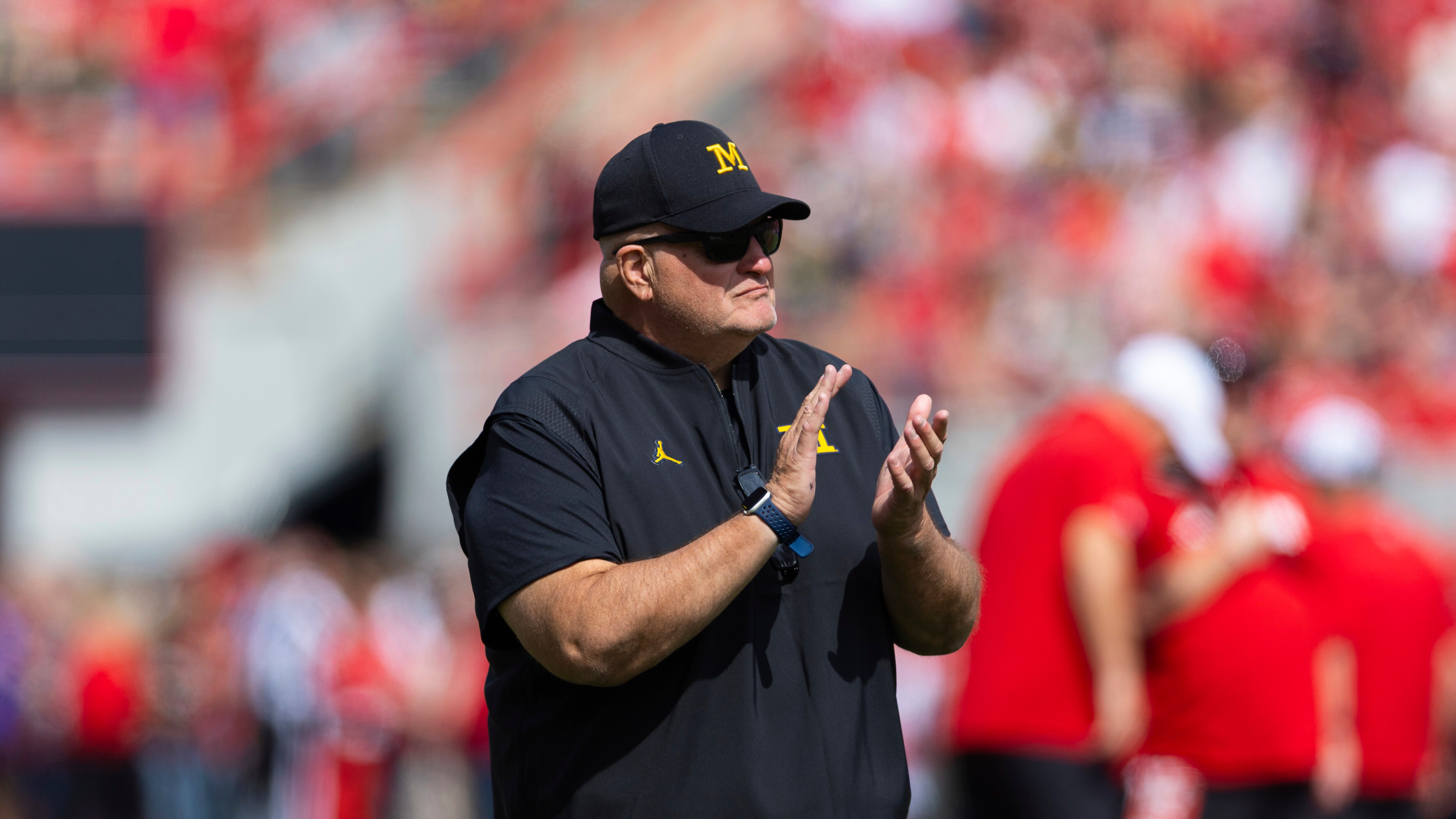 Biff Poggi watches his team warm up before playing against Nebraska in an NCAA college football game Saturday, Sept. 20, 2025, in Lincoln, Neb.
