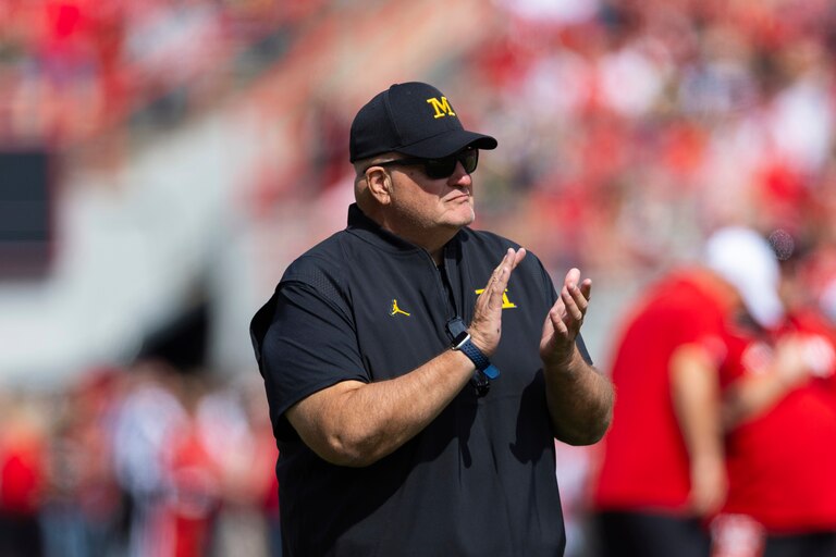 Biff Poggi watches his team warm up before playing against Nebraska in an NCAA college football game Saturday, Sept. 20, 2025, in Lincoln, Neb.