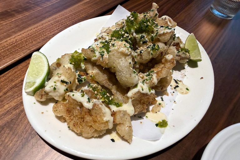 Flour and Wood's specialty is Neapolitan-style pizza. The menu also features a range of vibrant Italian-influenced specialties like panzanella salad, gamberone al forno, and crispy mushrooms with punchy fermented jalapeno.