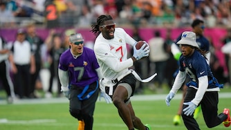 FILE - AFC wide receiver Brian Thomas Jr. (7), of the Jacksonville Jaguars, runs away from NFC return specialist KaVontae Turpin, of the Dallas Cowboys, right, during the flag football event at the NFL Pro Bowl, Sunday, Feb. 2, 2025, in Orlando.