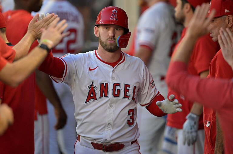 Los Angeles outfielder Taylor Ward is greeted in the dugout after scoring a run during the first inning against the Minnesota Twins on Sept. 9.