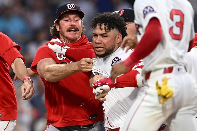 Willson Contreras of the Boston Red Sox, center, is held back after an altercation against the Washington Nationals during the fourth inning.