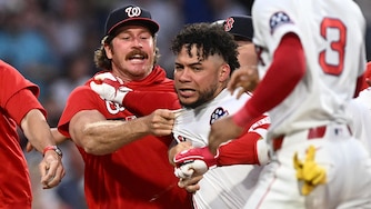 Willson Contreras of the Boston Red Sox, center, is held back after an altercation against the Washington Nationals during the fourth inning.