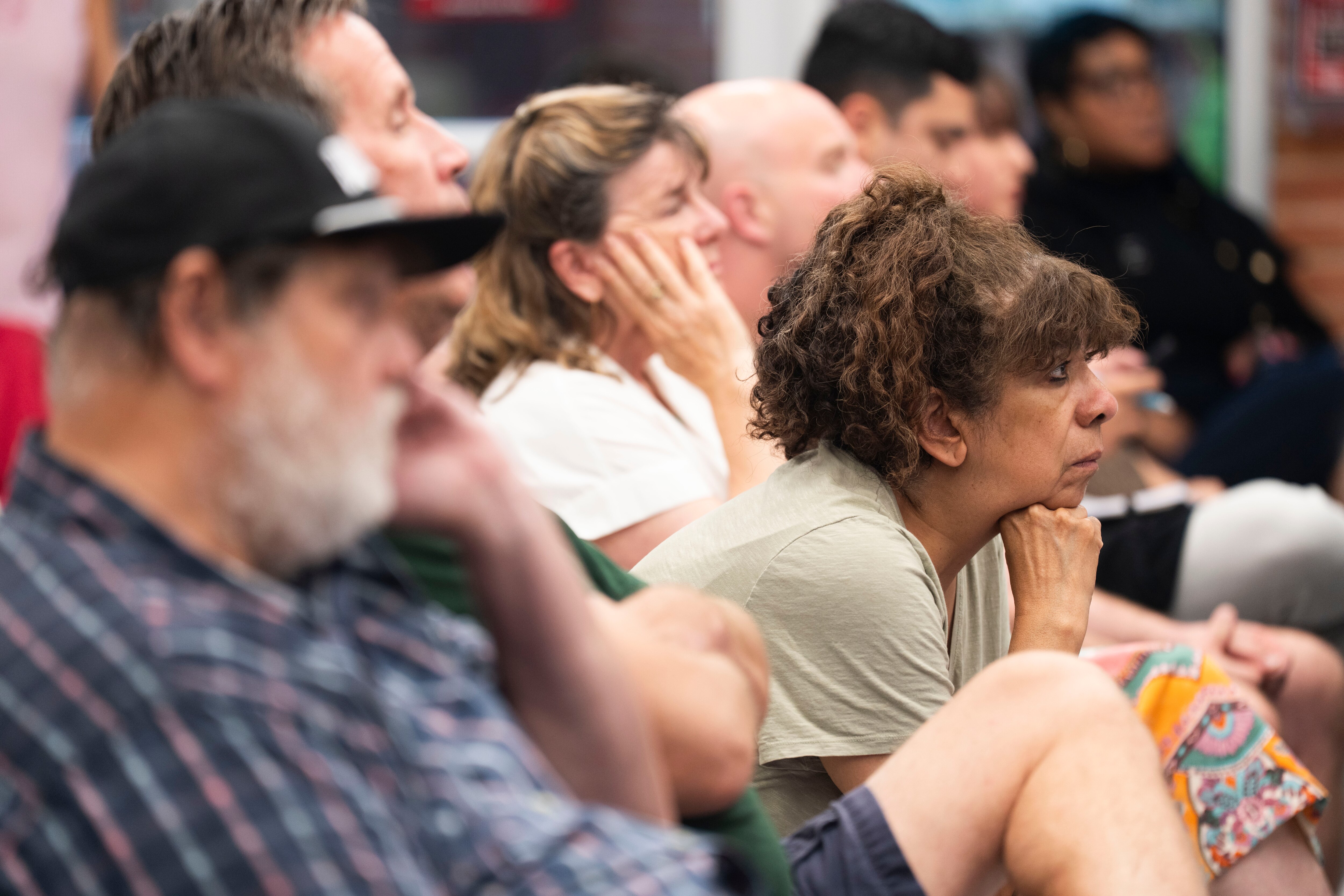 Concerned and curious community members sit in on a town hall meeting to discuss the fate of the Catonsville Armory on Monday.