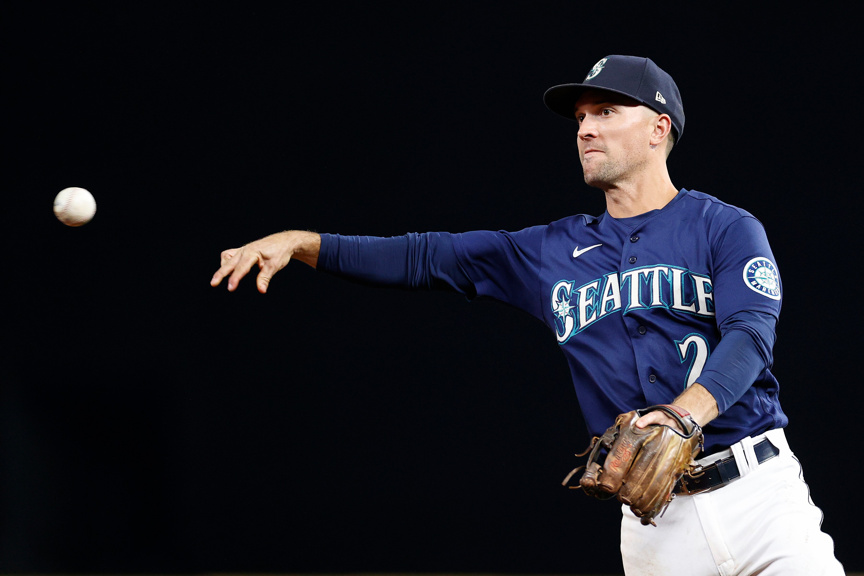 SEATTLE, WASHINGTON - OCTOBER 03: Adam Frazier #26 of the Seattle Mariners throws to first base during the fourth inning against the Detroit Tigers at T-Mobile Park on October 03, 2022 in Seattle, Washington.