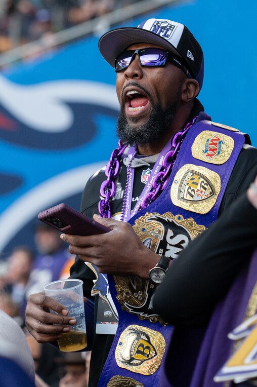 Herb Williams and Marty Girch passionately cheer for the Ravens during the matchup against the Tennessee Titans in Tottenham Hotspur Stadium on Oct. 15, 2023.