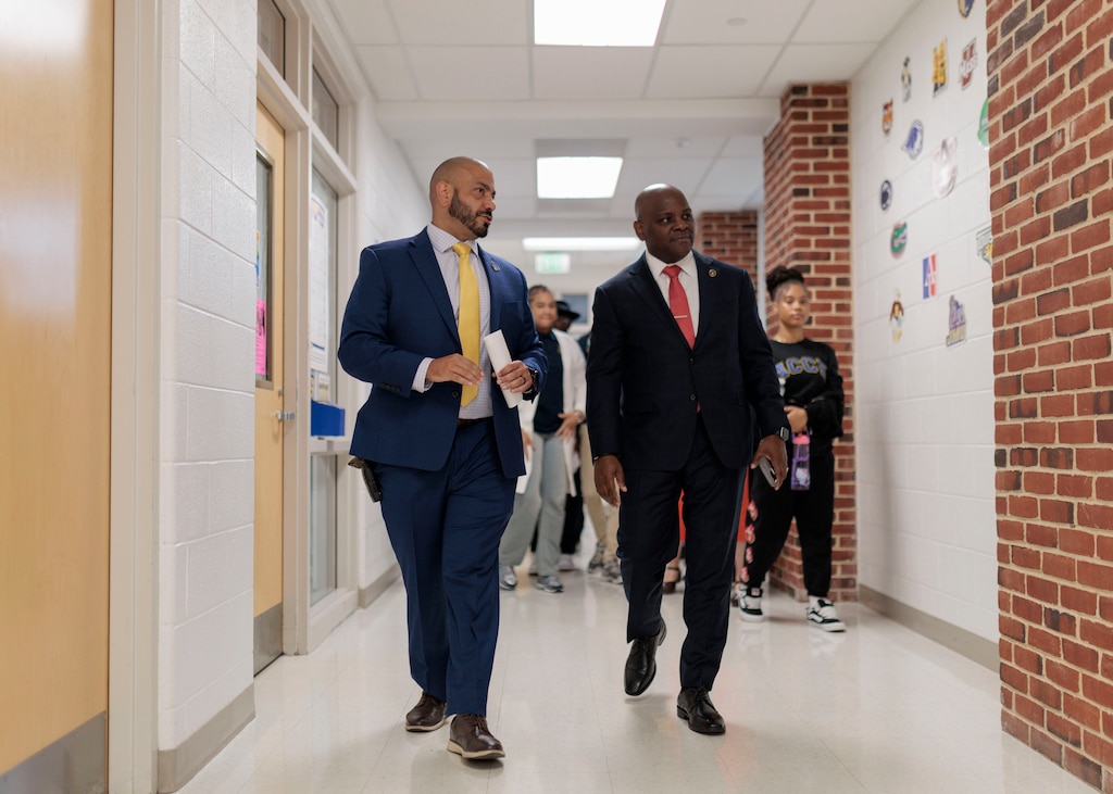 Dr. Jermaine Dawson, the new CEO of Baltimore City Public Schools, tours the Academy for College and Career Exploration in Hampden alongside Principal Luis Espinoza.