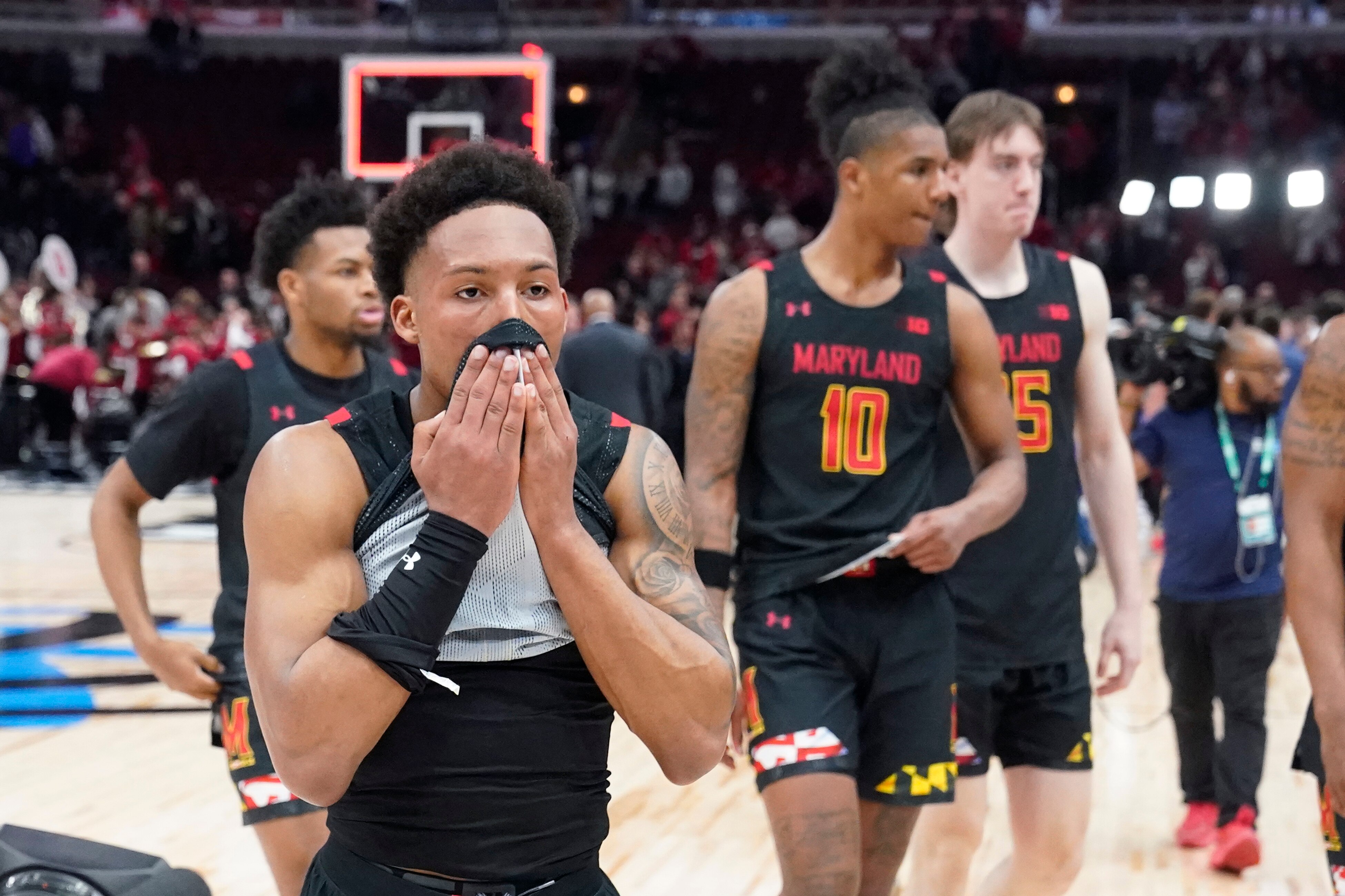 Maryland's Jahmir Young walks off the court with teammates after Maryland's 70-60 loss to Indiana after an NCAA college basketball game at the Big Ten men's tournament, Friday, March 10, 2023, in Chicago. (AP Photo/Charles Rex Arbogast)