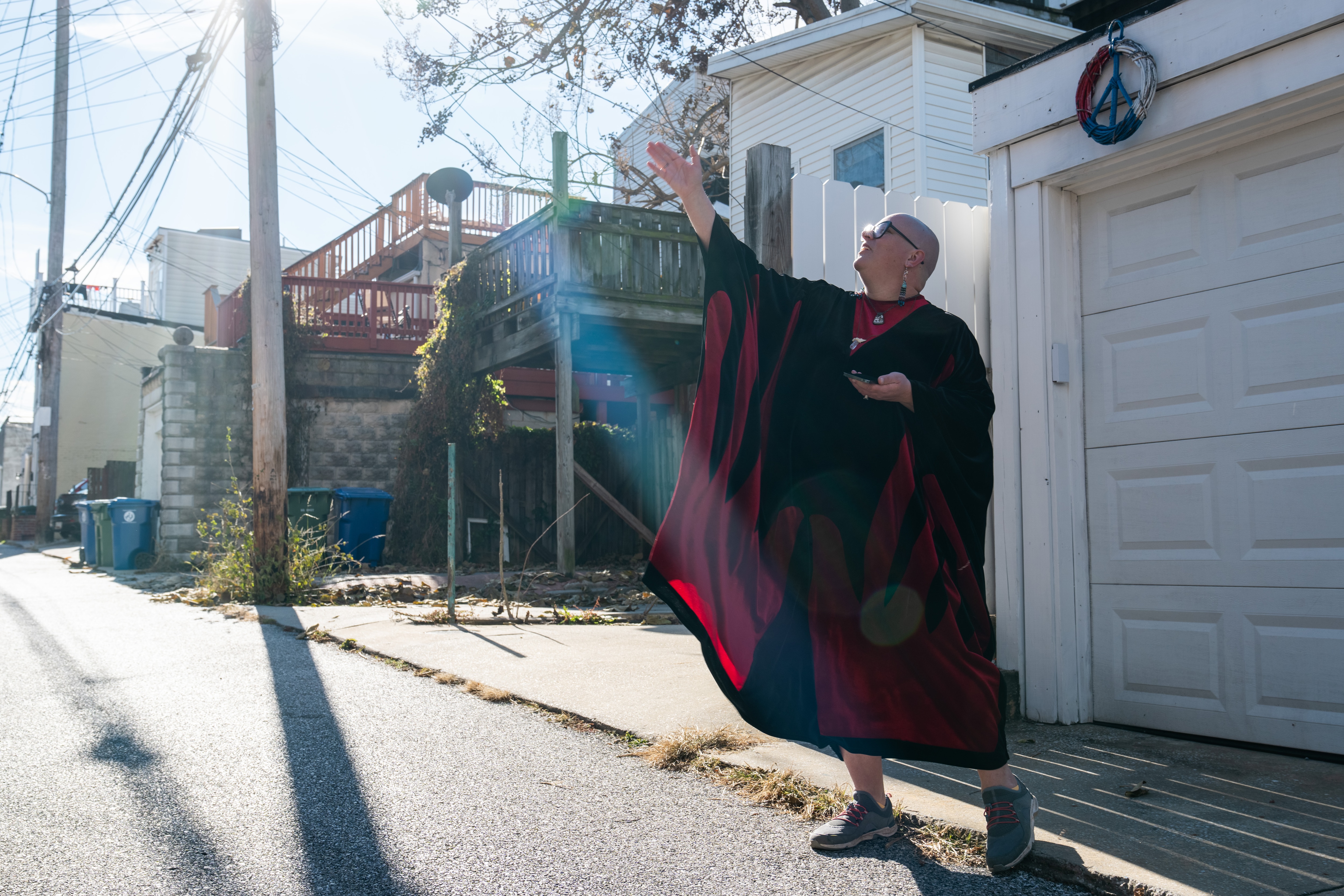 Dr. Katie Labor points up at a building on Durst Street in Federal Hill.