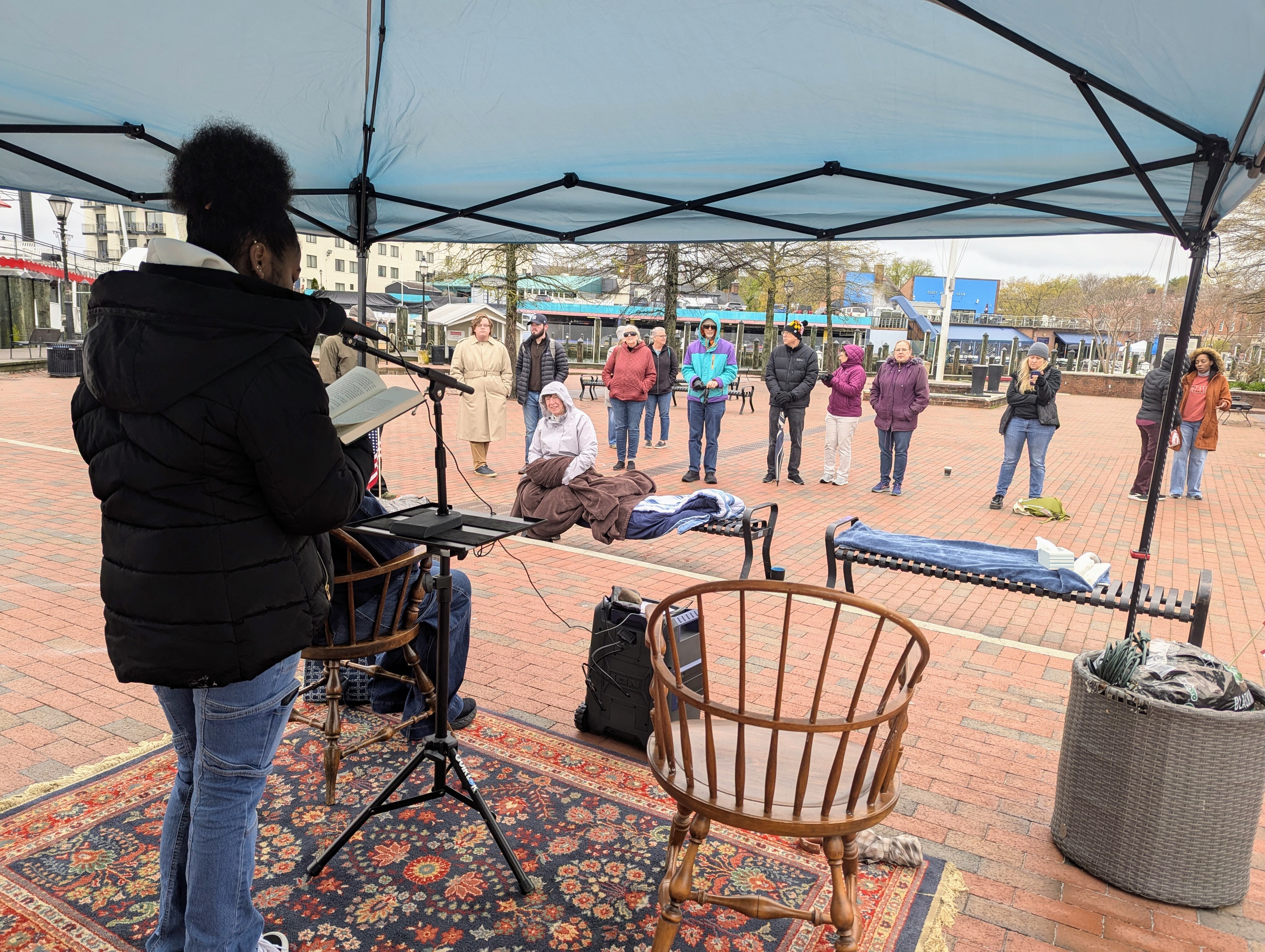 Kaylee Jones, a student at Annapolis High School, reads from "I Know Why the Caged Bird Sings" on April 12, 2025 in Annapolis, MD. The book was banned from the Naval Academy library.