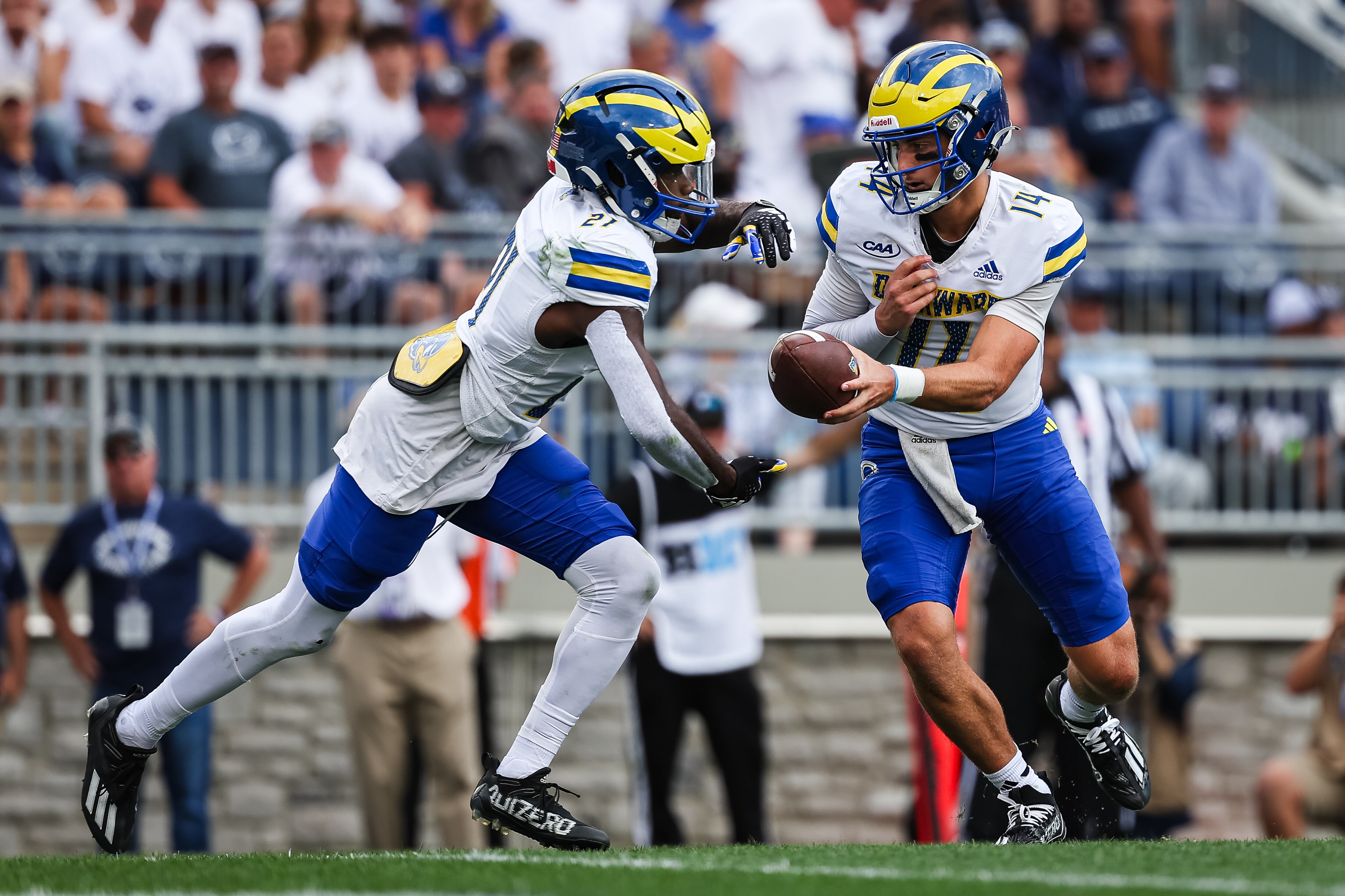 Delaware's Marcus Yarns (left), pictured against Penn State, scored five touchdowns Saturday in the Blue Hens' victory over Towson.