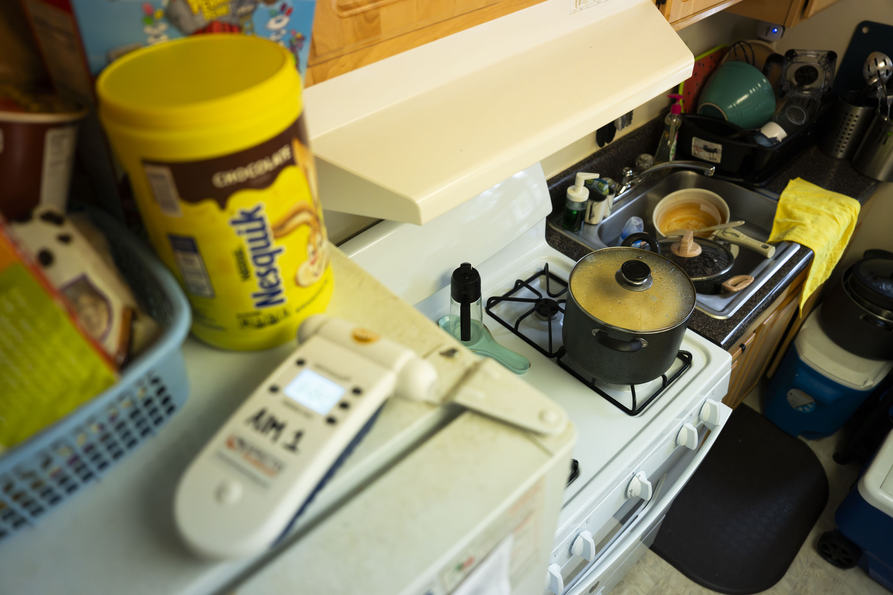 Residents of an apartment in Silver Spring use an air quality tester to test the levels of nitrogen dioxide in their home after briefly cooking on the stove. The air levels of NO2 are high and do not sharply decrease when the stove is turned off; the rate remains steady long after the cooking is complete.