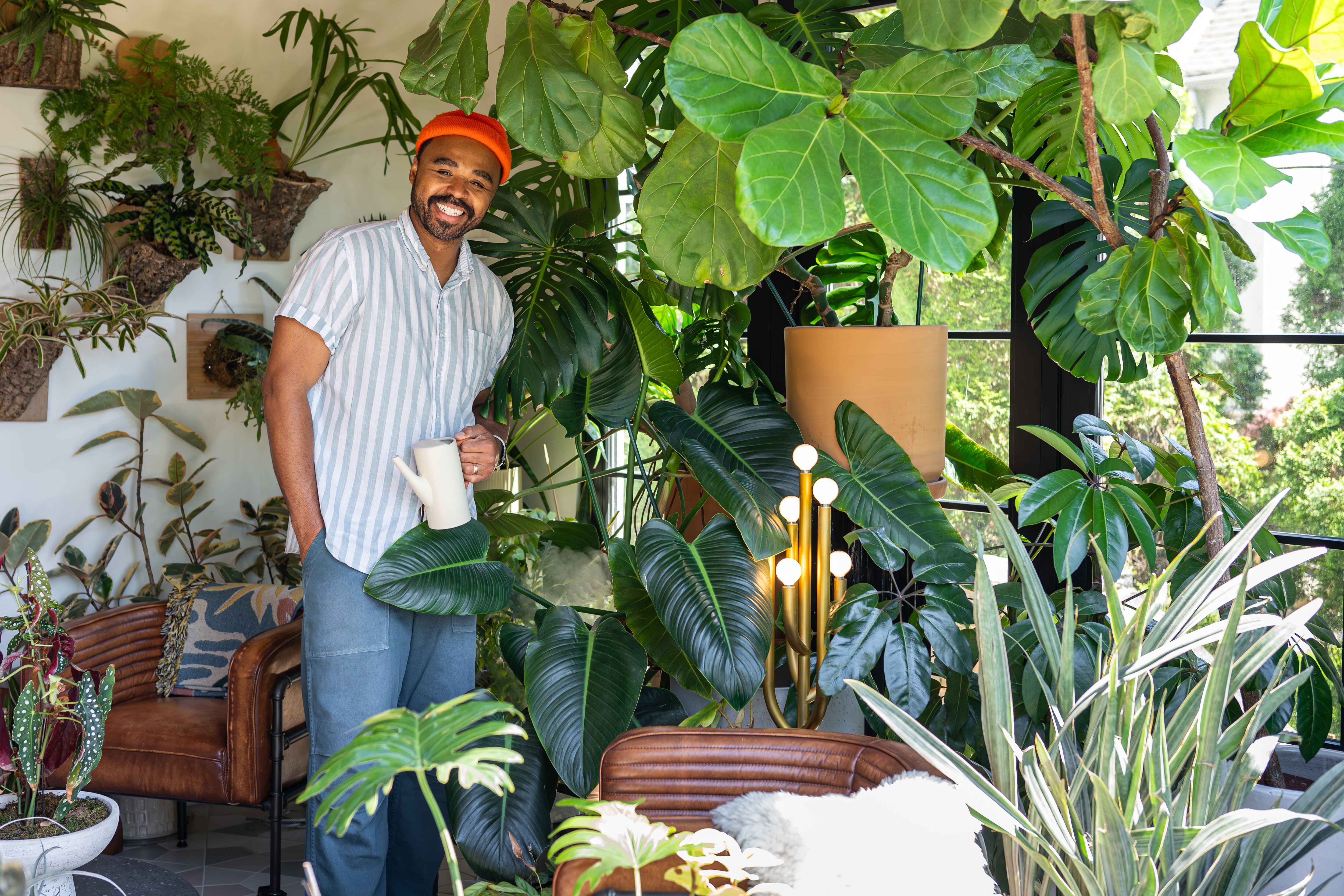 Plant and interior stylist, artist and author Hilton Carter with his houseplants.