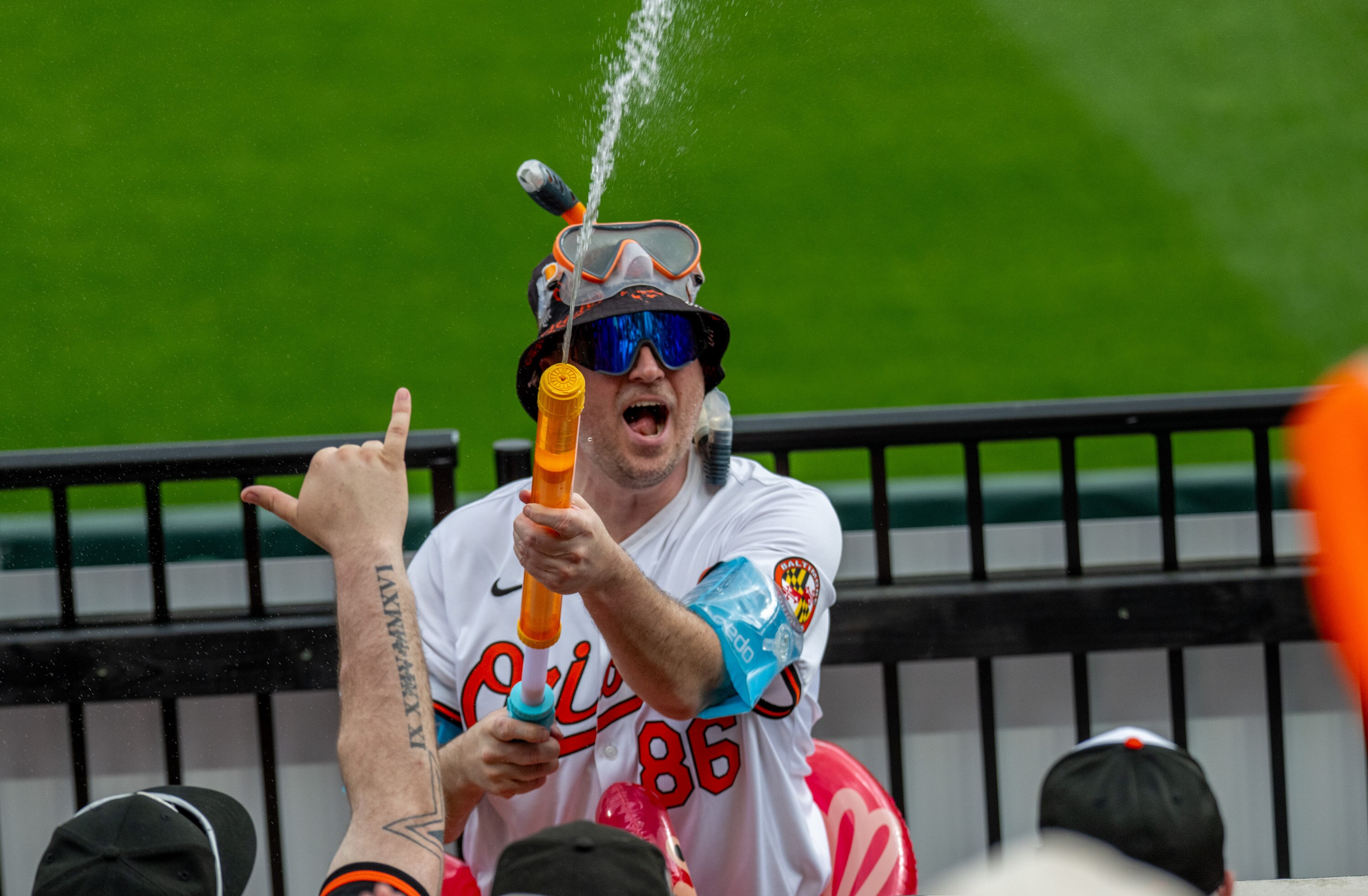 Mr Splash fires up and cools off outfield fans during the Orioles 2025 home opener against the Boston Red Sox on Monday, March 31, 2025.