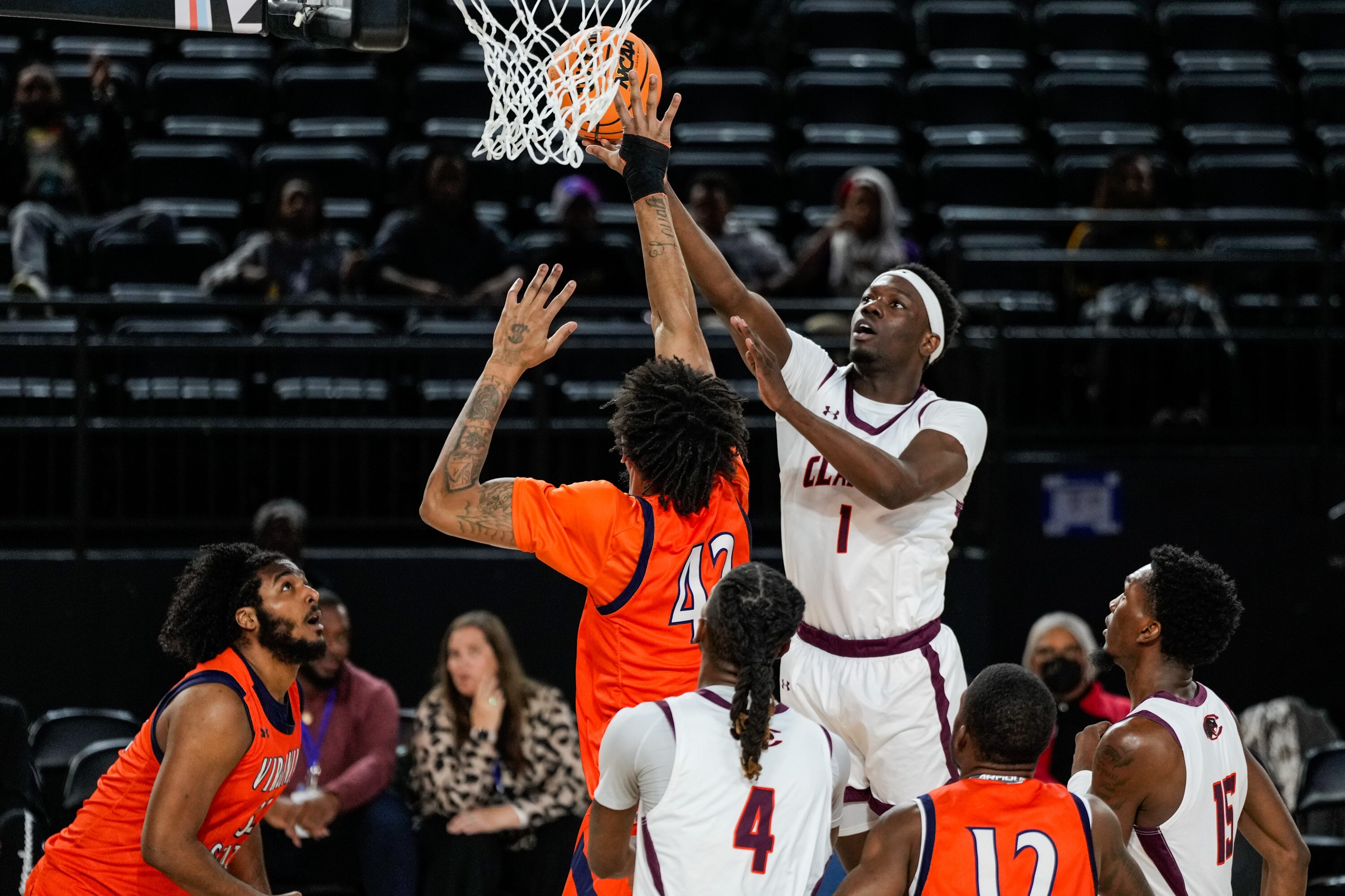 Claflin University guard/forward Zion Obanla scores during a CIAA men’s basketball quarterfinal  against Virginia State University at CFG Bank Arena on Thursday.