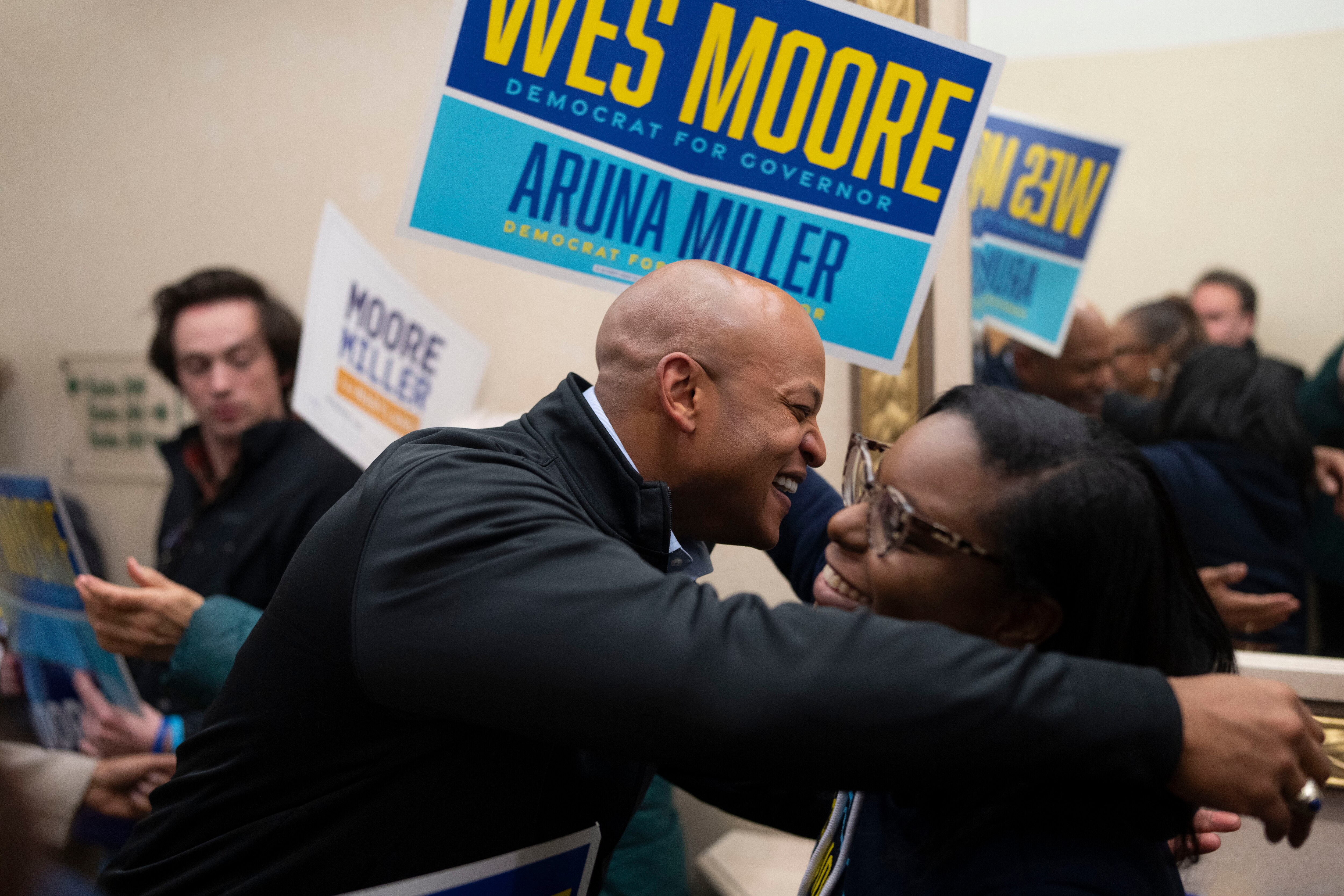 Gov. Wes Moore hugs Karen Darkes, executive director of the Maryland Democratic Party, after filing for reelection at the State Board of Elections headquarters in Annapolis on Monday.