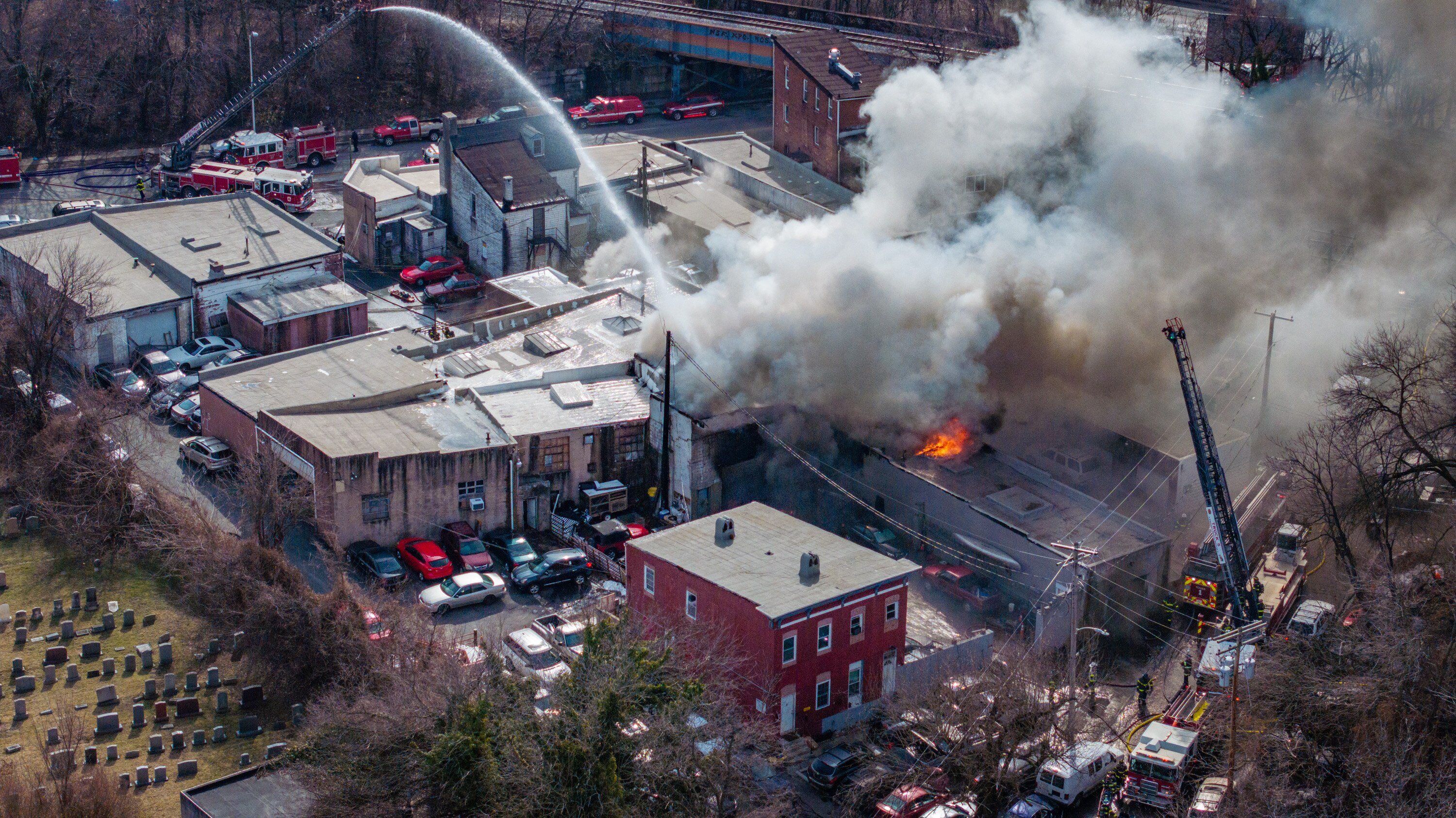 Baltimore City Fire Department units respond to a commercial building fire in the 2000 block of North Rose Street.