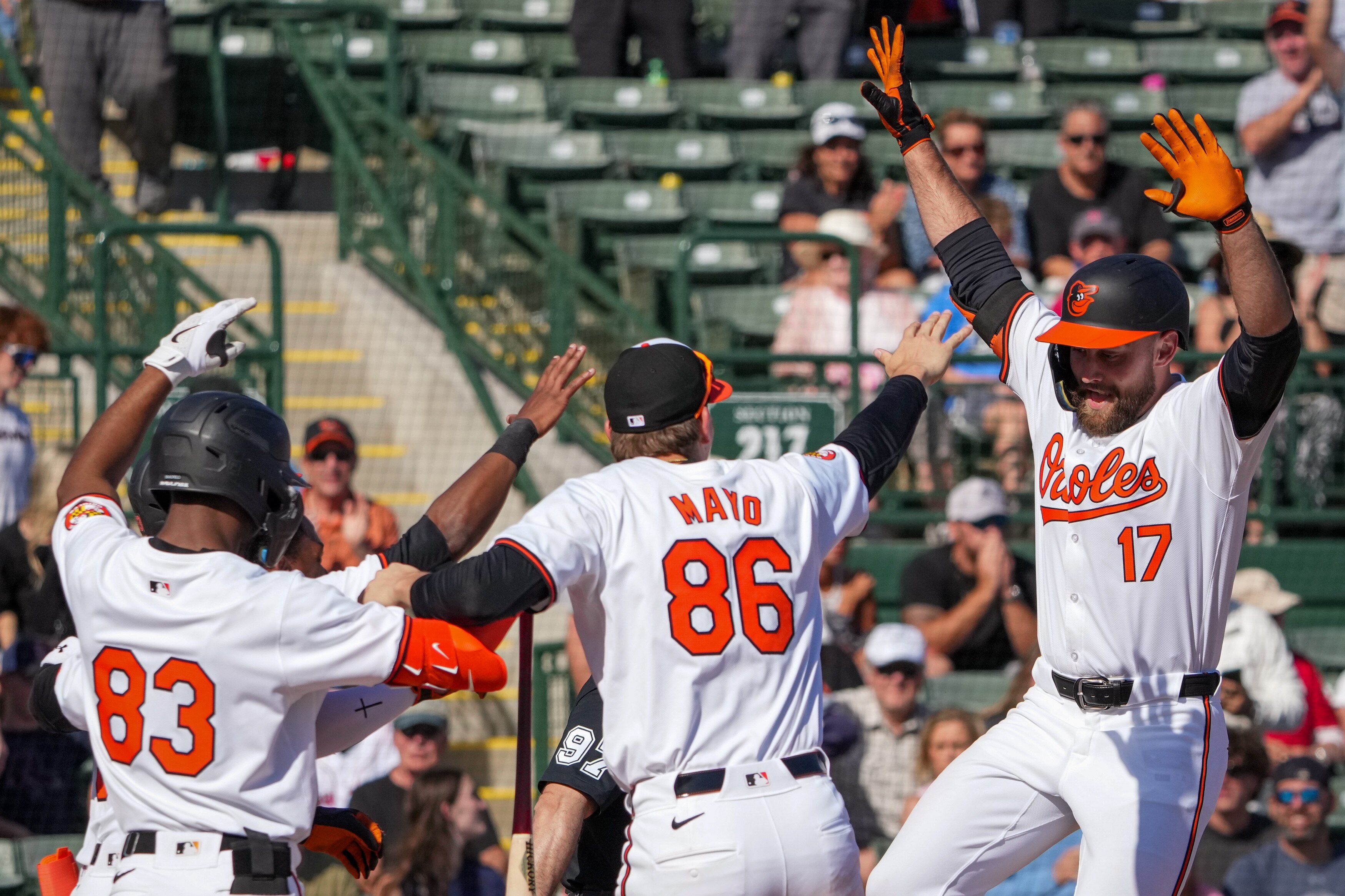 Baltimore Orioles center fielder Colton Cowser (17) celebrates with teammates after hitting a walk-off 2-run homer in the team’s home opener against the Boston Red Sox at Ed Smith Stadium on February 24, 2024. The Orioles beat the Red Sox, 4-3, in the Grapefruit League game.