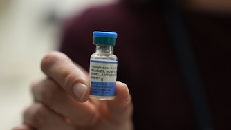 FILE - Dr. Jessica Early holds a vial of the combination measles, mumps and rubella vaccine at Prisma Health Pediatrics in Greer, S.C., March 18, 2026.
