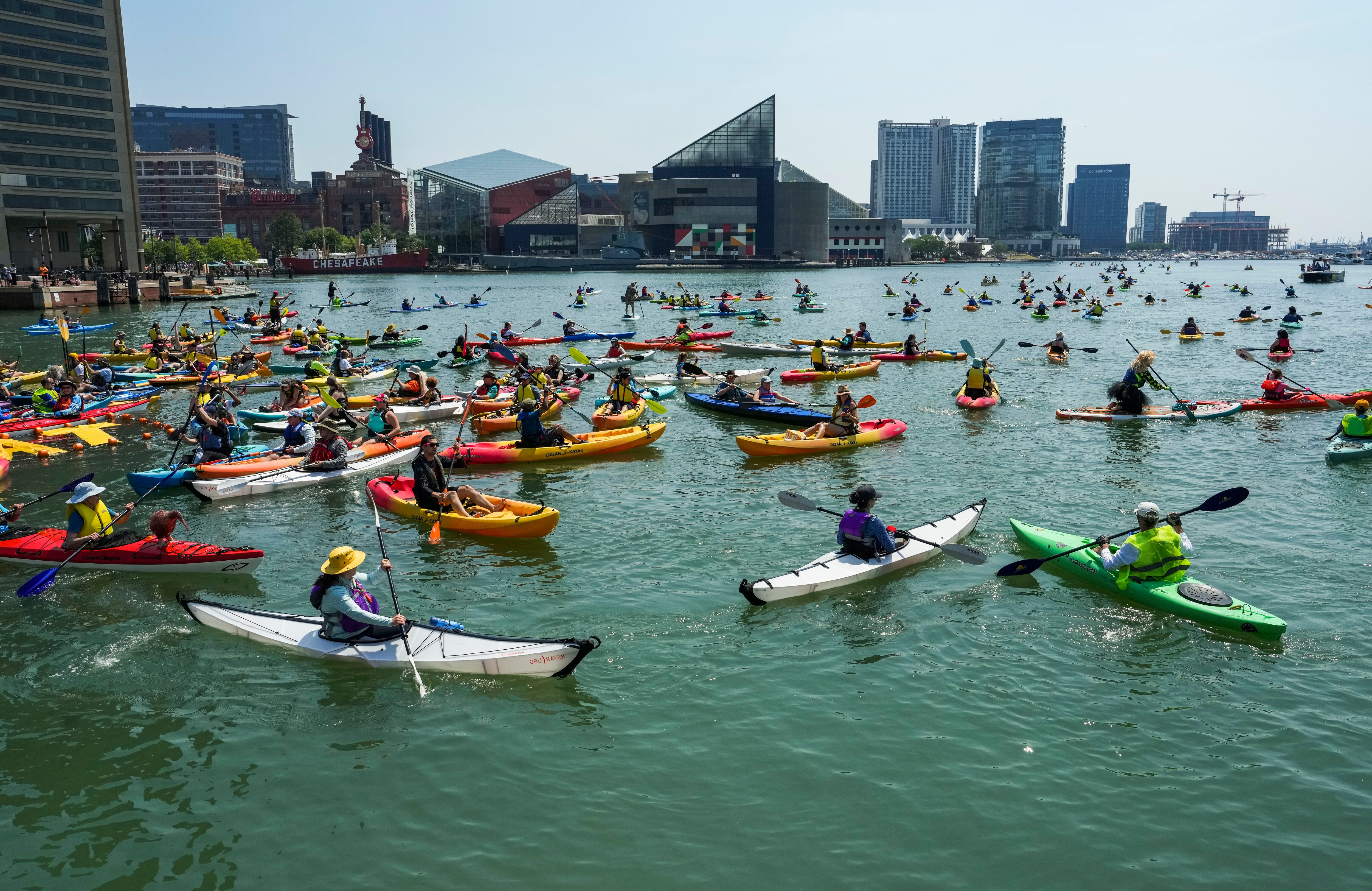 Paddlers make the 5-mile round trip journey from Canton Waterfront Park to the Inner Harbor during the annual Floatilla on June 10, 2023.