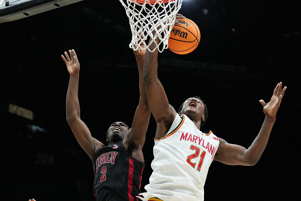 Pharrel Payne #21 of the Maryland Terrapins battles for rebound with Kimani Hamilton #2 of the UNLV Rebels in the second half.