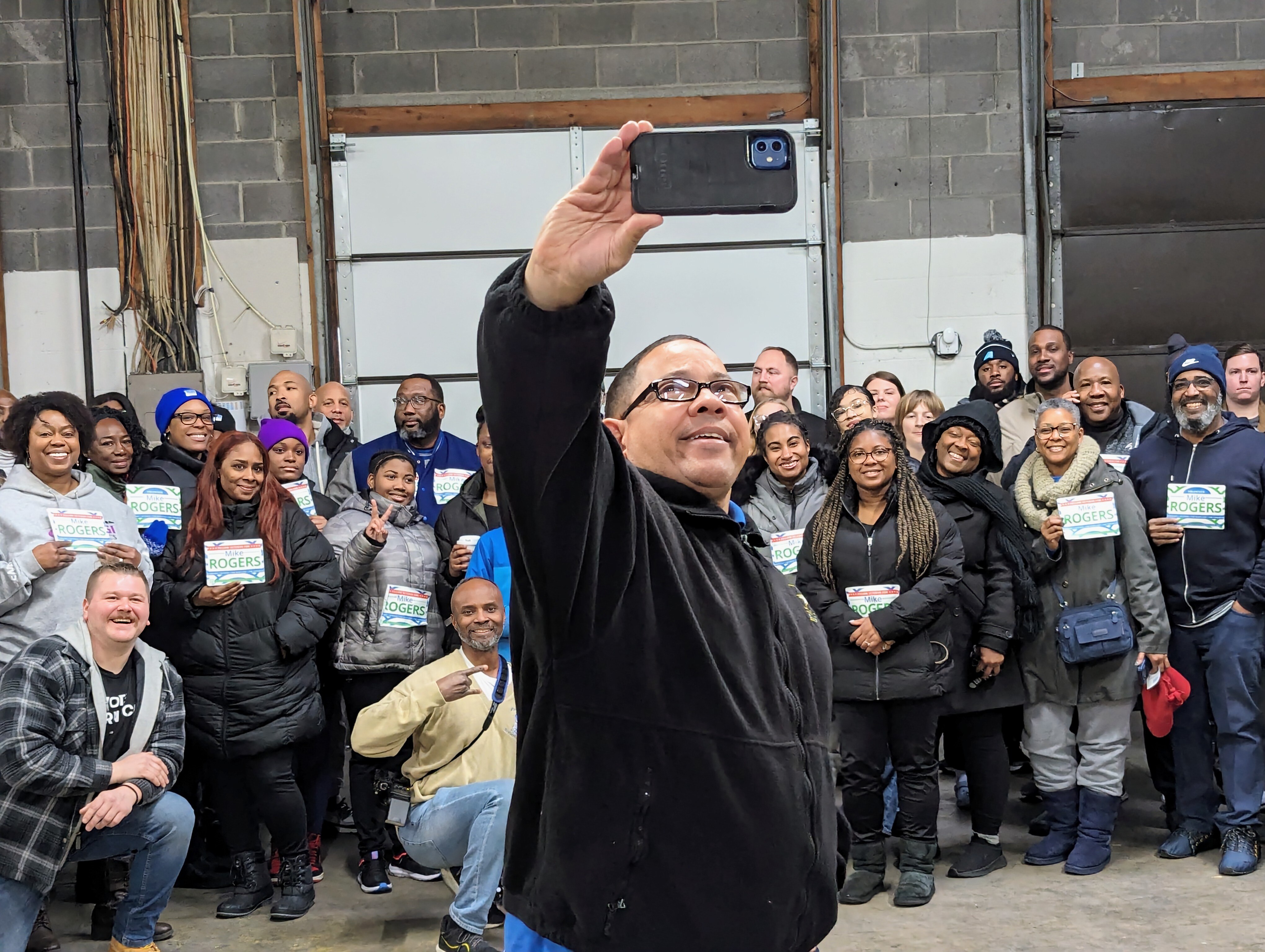 Del. Mike Rogers takes a selfie on Jan. 2, 2024 in Hanover with volunteers for his campaign to be the Democratic nominee for Congress in the 3rd District. Five members of the state legislature are competing with Rogers.