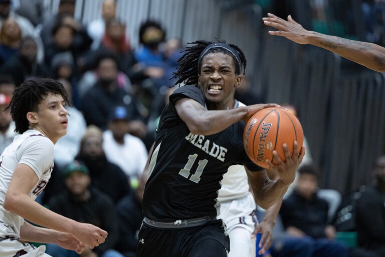 Meade’s Xavion Roberson (11) drives the ball down court during the Anne Arundel County Boys Basketball Championship game in Odenton, Md., on Saturday, February 18, 2023. Meade defeated Broadneck 60-51 in regulation time to win the championship.