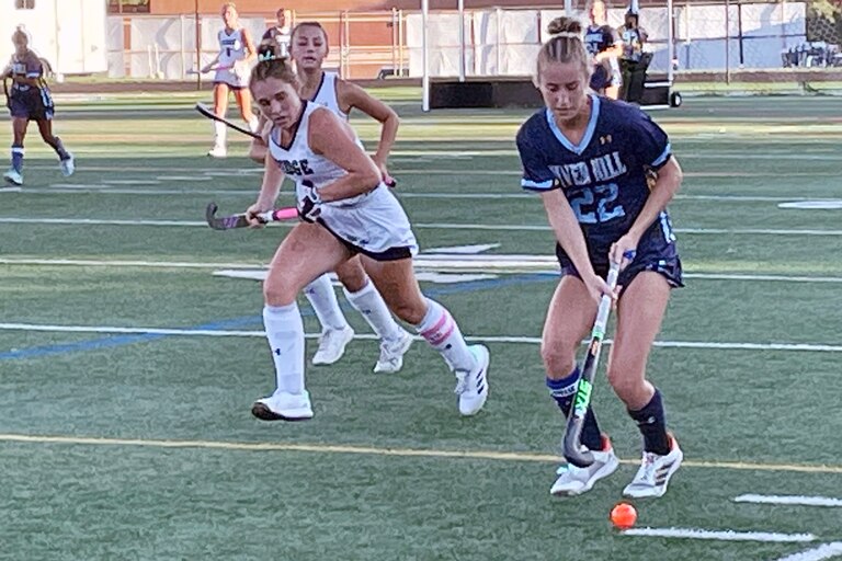 River Hill’s Maddie Vasilios (22) moves the ball downfield in Wednesday’s 6-3 win at No. 8 Marriotts Ridge. A senior headed for Maryland, Vasilios scored four goals as the No. 7 Hawks remained undefeated against Howard County competition.