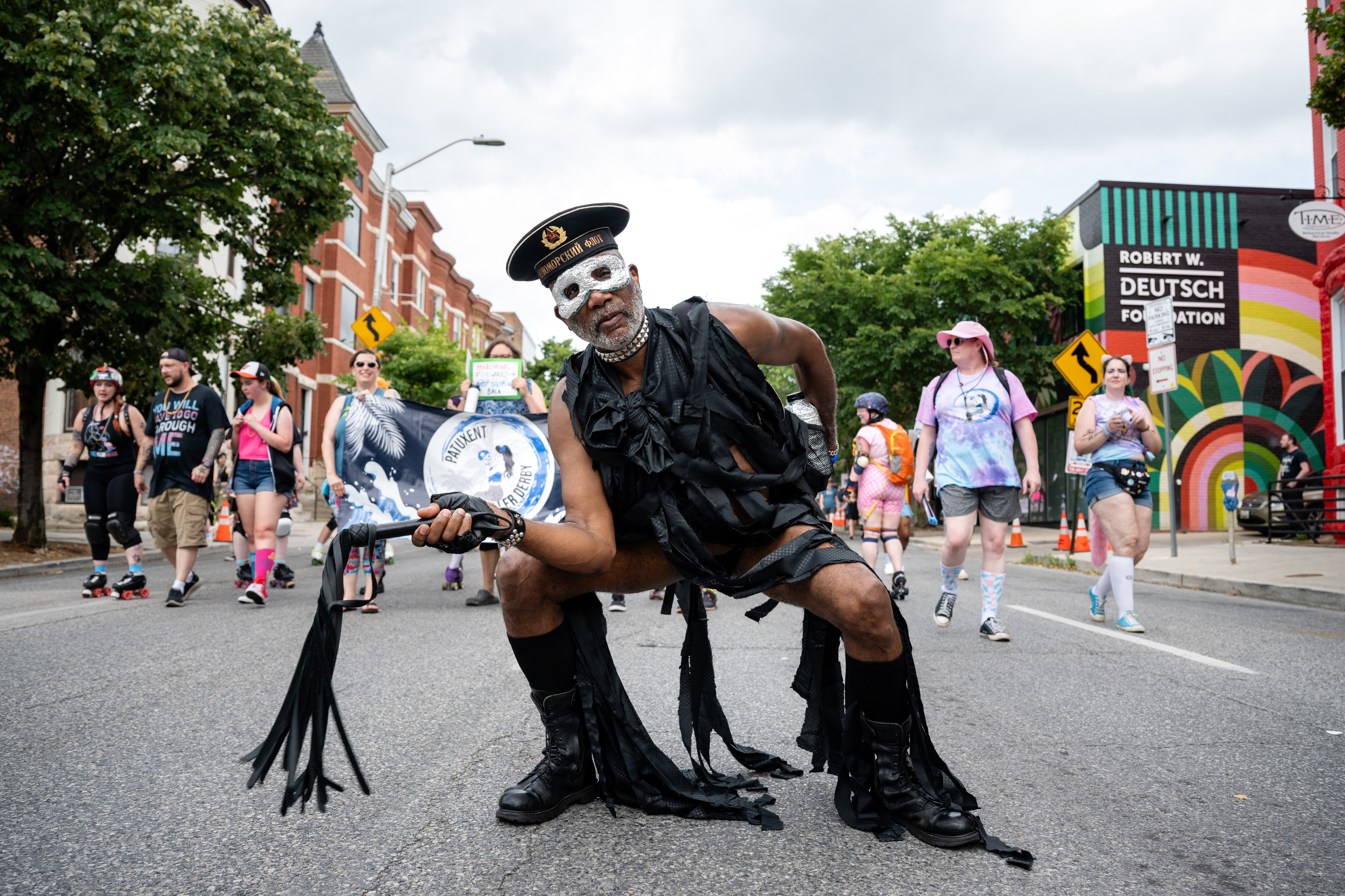 A participant in the Baltimore Trans Pride Grand March poses for a photo in Baltimore, MD on 6/29/2024.