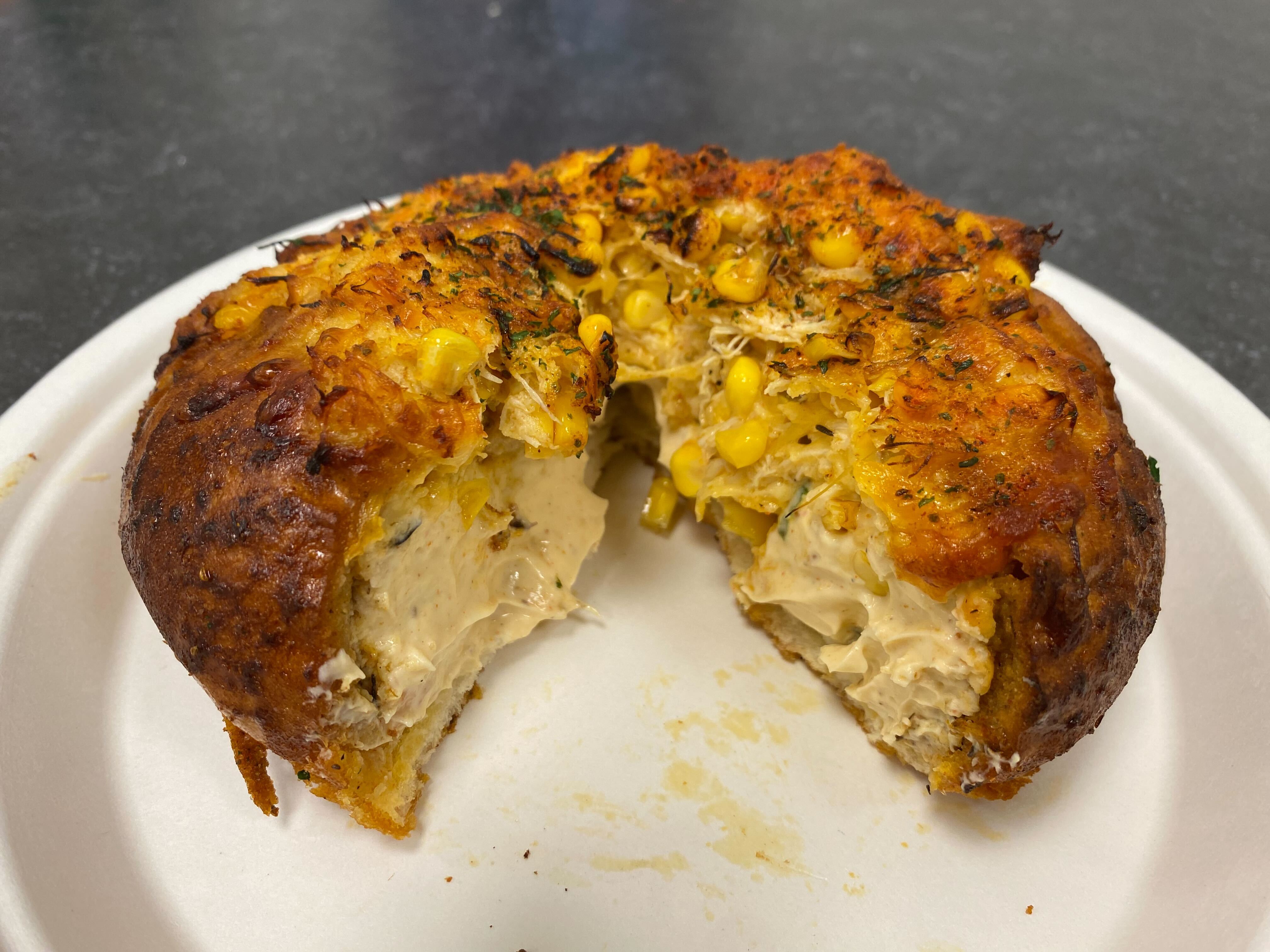 Café Dear Leon's viral crab dip bagel has a gooey inside of crab dip topped with lump Indonesian crab meat and kernels of corn.